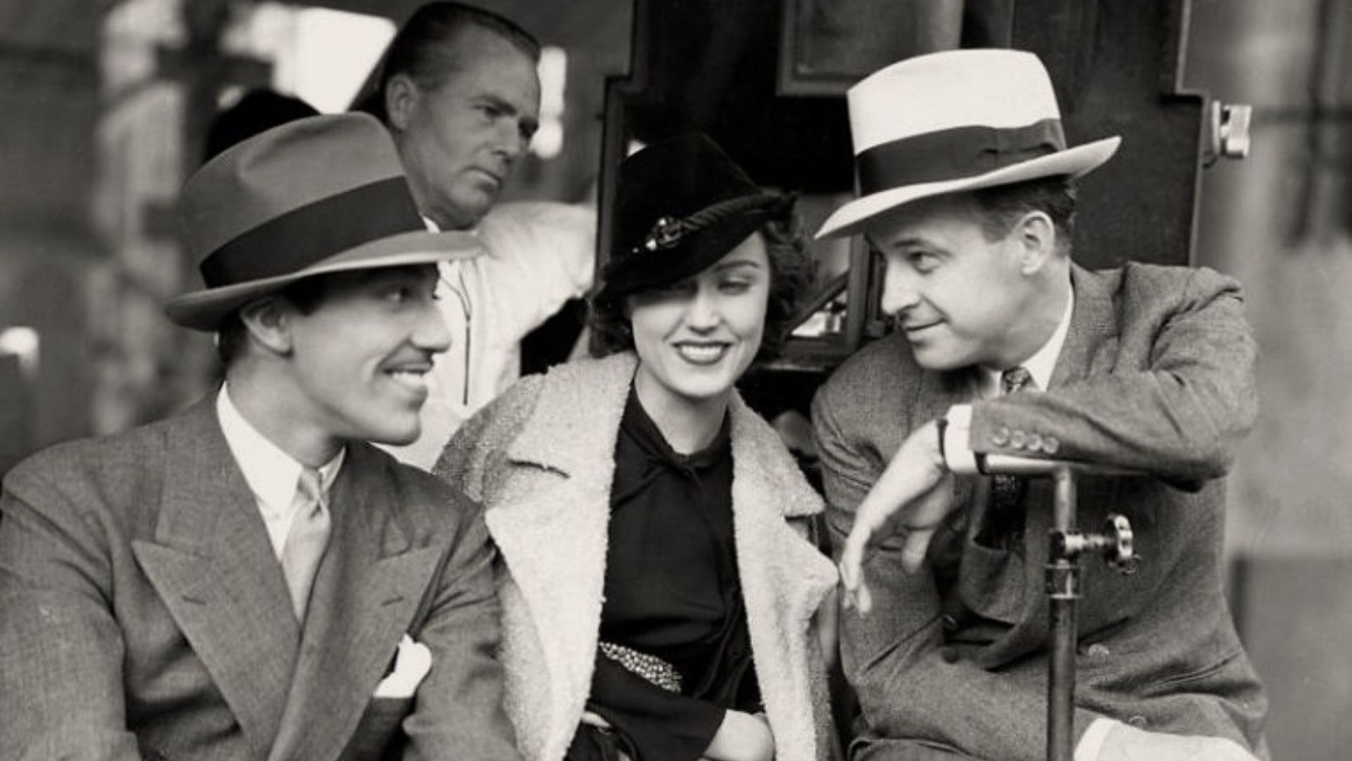 L. to R. : Cesar Romero, Fay Wray, director Richard Thorpe, and cinematographer George Robinson (behind them) on the set of Cheating Cheaters - publicity still