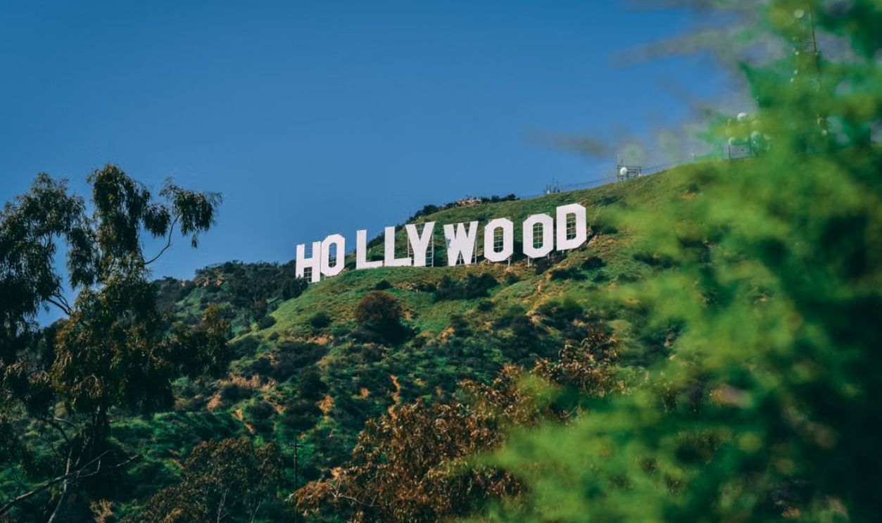 A scenic view of the famous Hollywood sign on a sunny day in Los Angeles