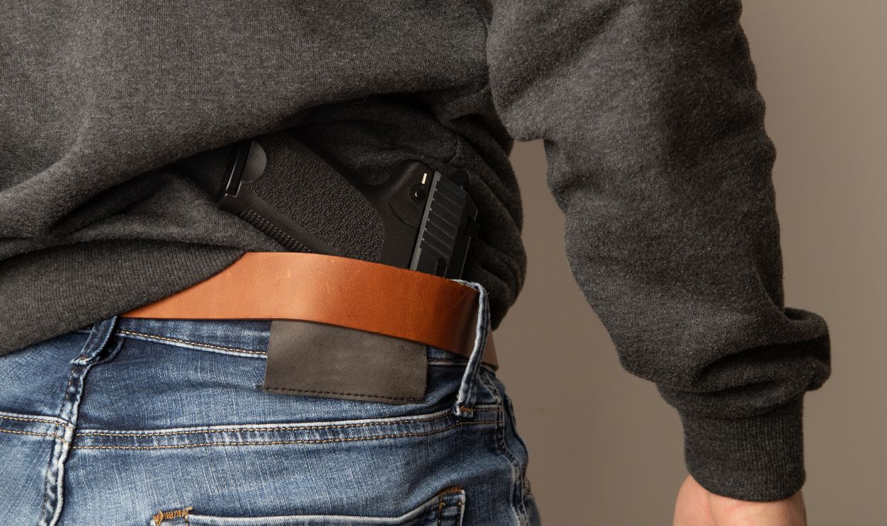 man with black pistol gun