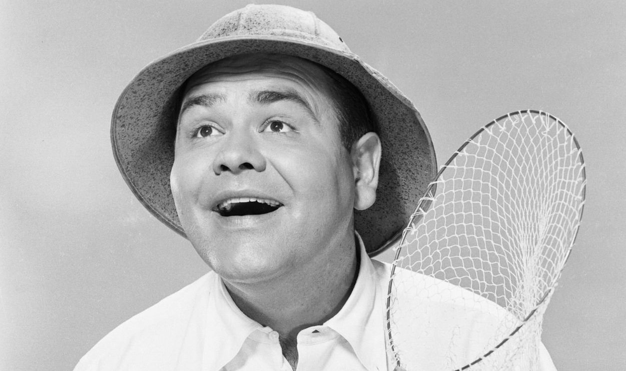 (Original Caption) New George Gobel? Man Of a 1,000 Faces! Jonathan Winters, who just might come off as a comedian-find of this summer's TV, is noted for his quickening impressions. En route from New York to Hollywood where he is now starring in the George Gobel summer replacement show on NBC, And Here's The Show, Saturdays (10 PM EDT and PDT), Winters, an Ohioan, gathered these impressions of us Americans: This--the way the average newcomer to Hollywood generally winds up: Chasing butterflies.