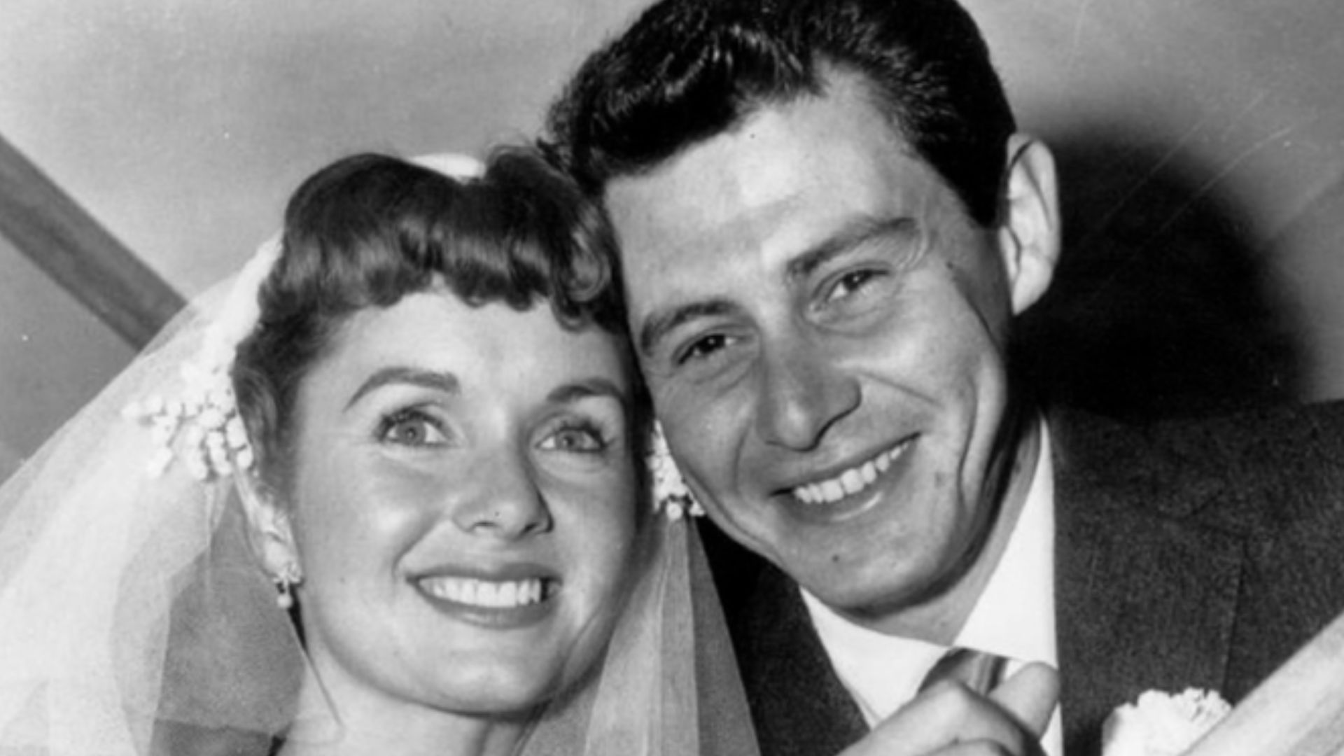 Press photo of Debbie Reynolds and Eddie Fisher at their wedding.