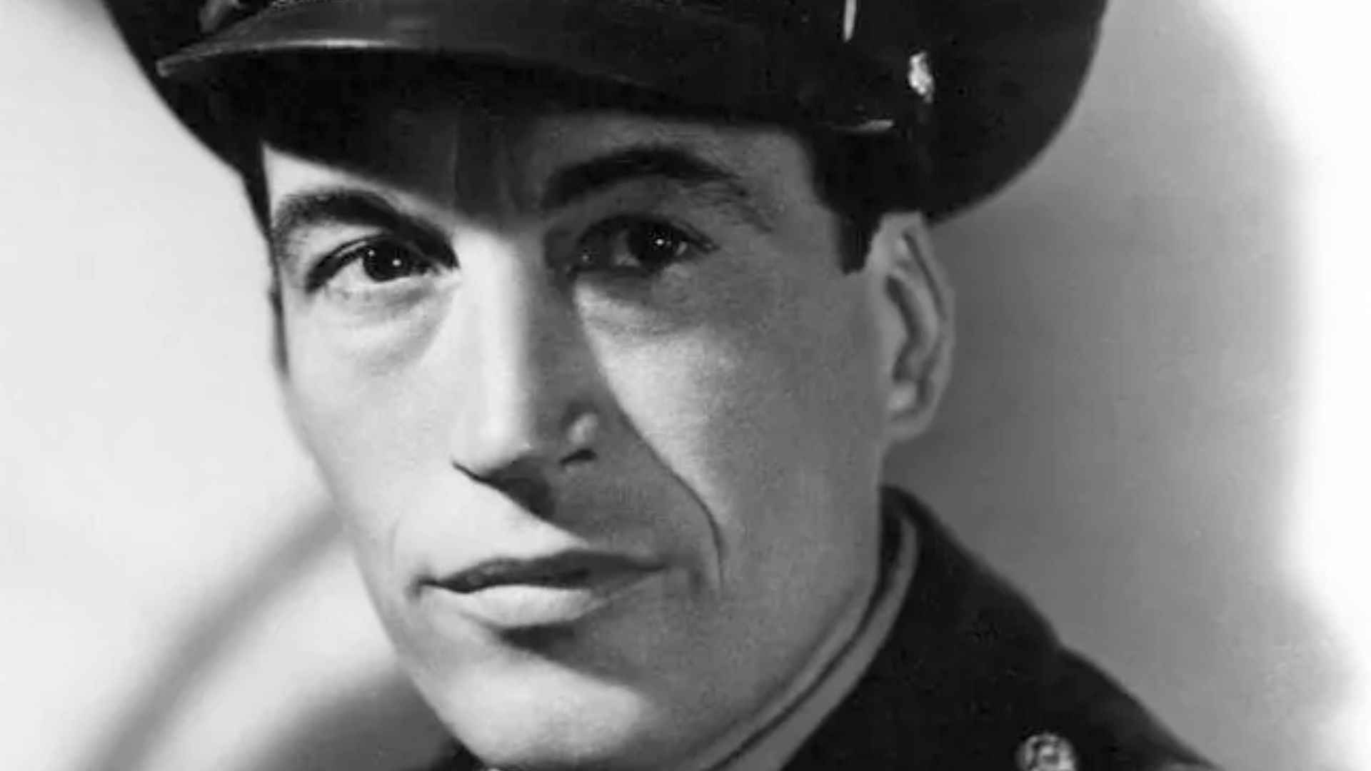 Portrait photograph of John Huston in U.S. Army uniform, published in New Movies, the National Board of Review Magazine