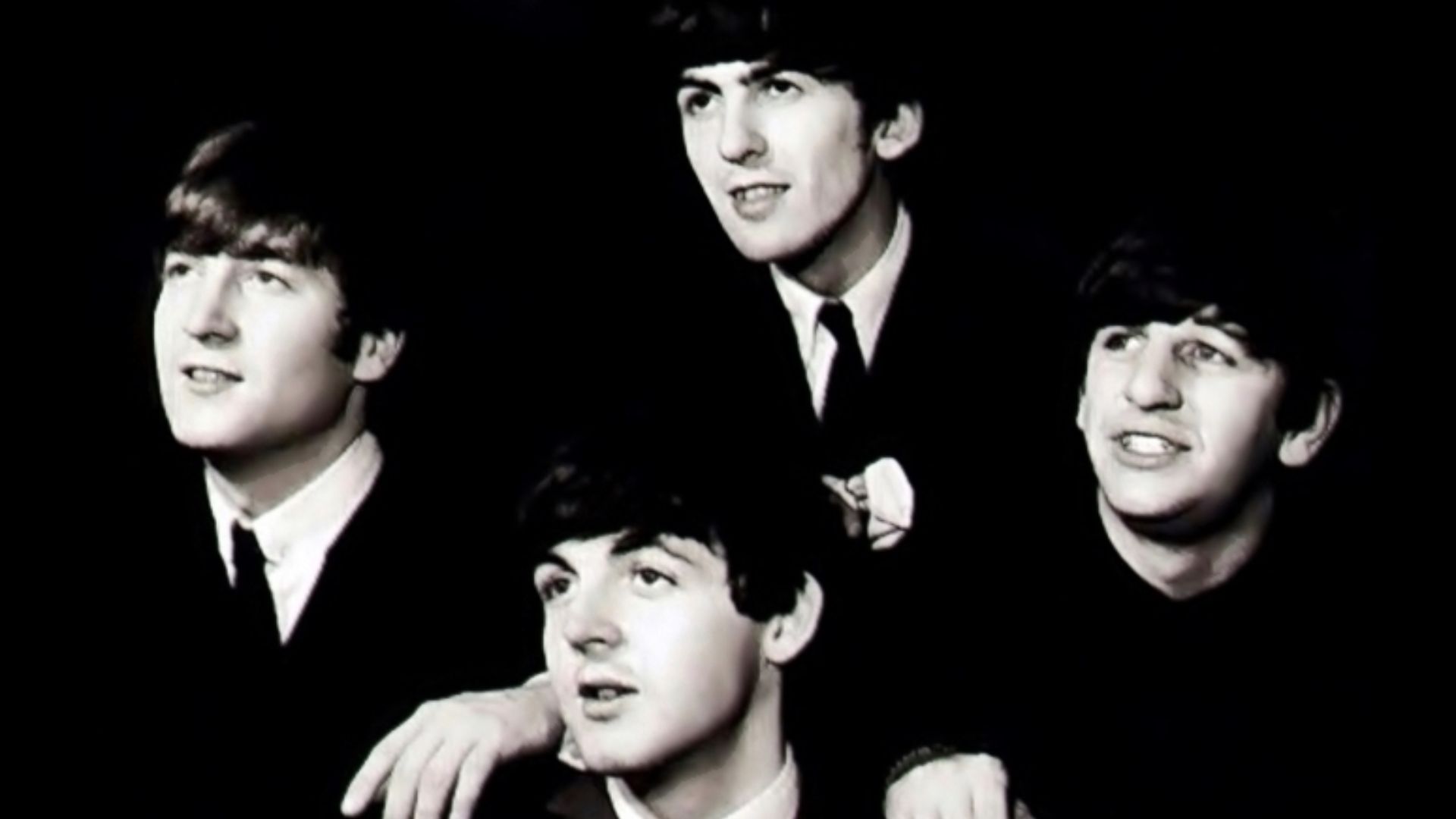 The Beatles in black background
