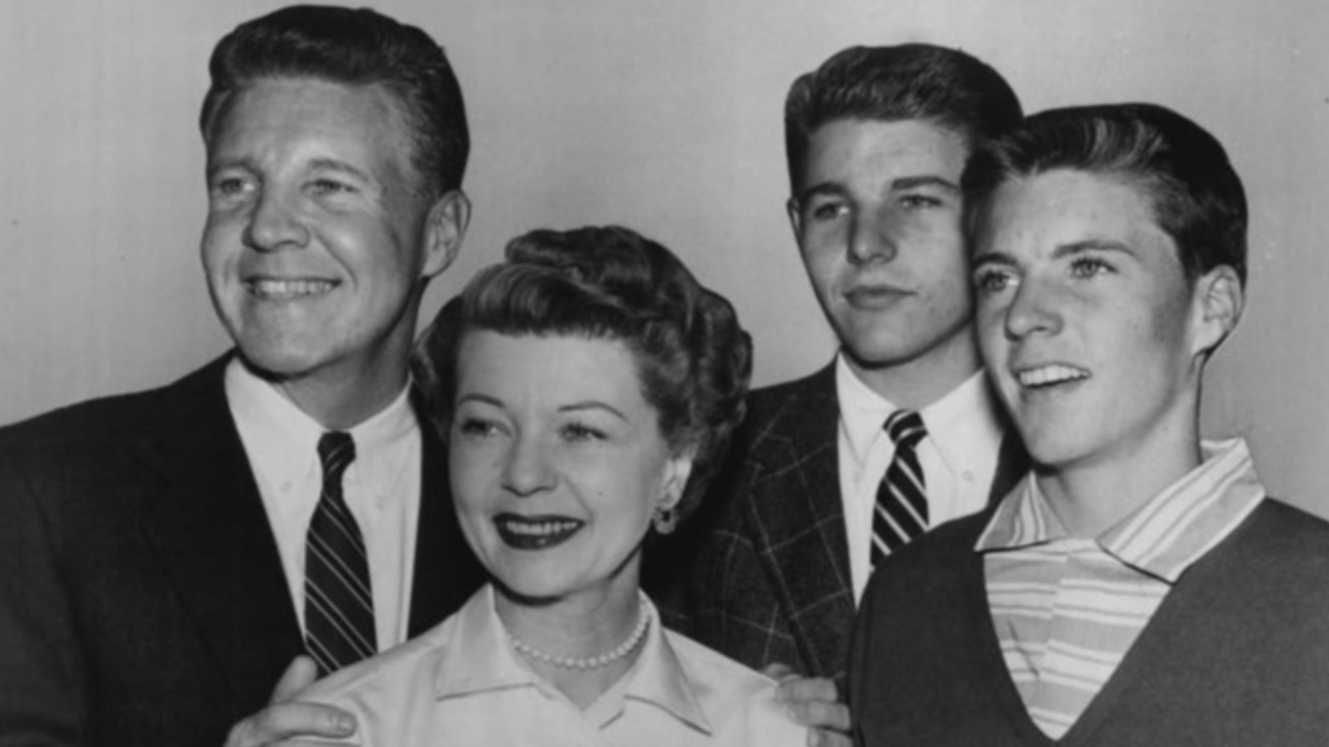 Publicity photo of American actors, (L–R) Ozzie Nelson, Harriet Nelson, David Nelson and Ricky Nelson promoting their roles on the ABC television series The Adventures of Ozzie and Harriet, circa 1956.