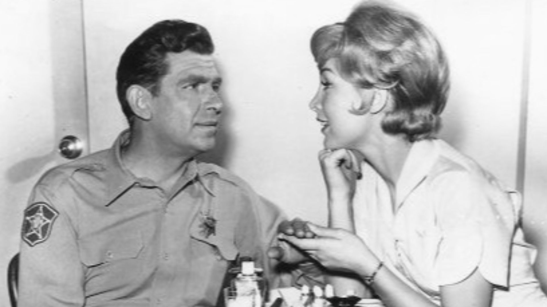 Photo of Andy Griffith and Barbara Eden from the television program The Andy Griffith Show. Andy goes for his first manicure as Floyd the Barber has hired one and finds a very attractive manicurist in Ellen Brown.