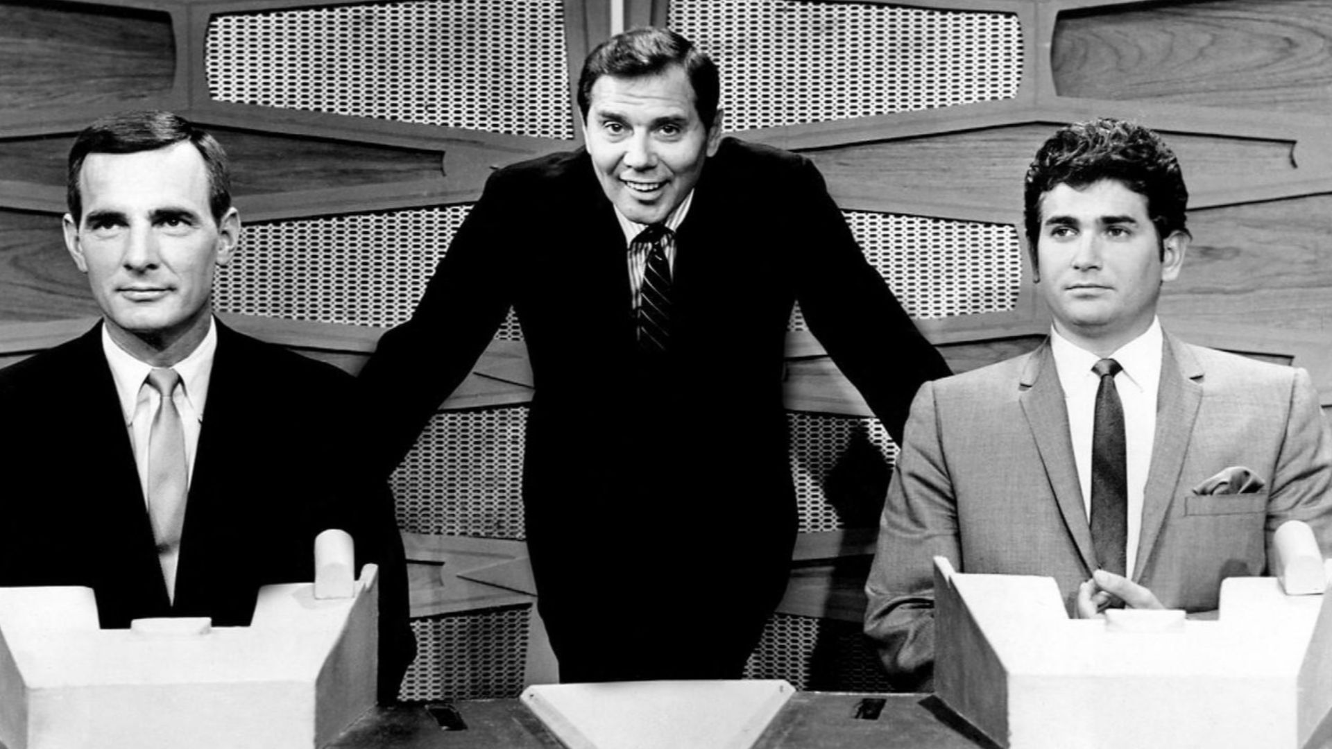 Photo of Gene Rayburn with Dennis Weaver and Michael Landon as celebrity team captains for a special edition of the television game program The Match Game.