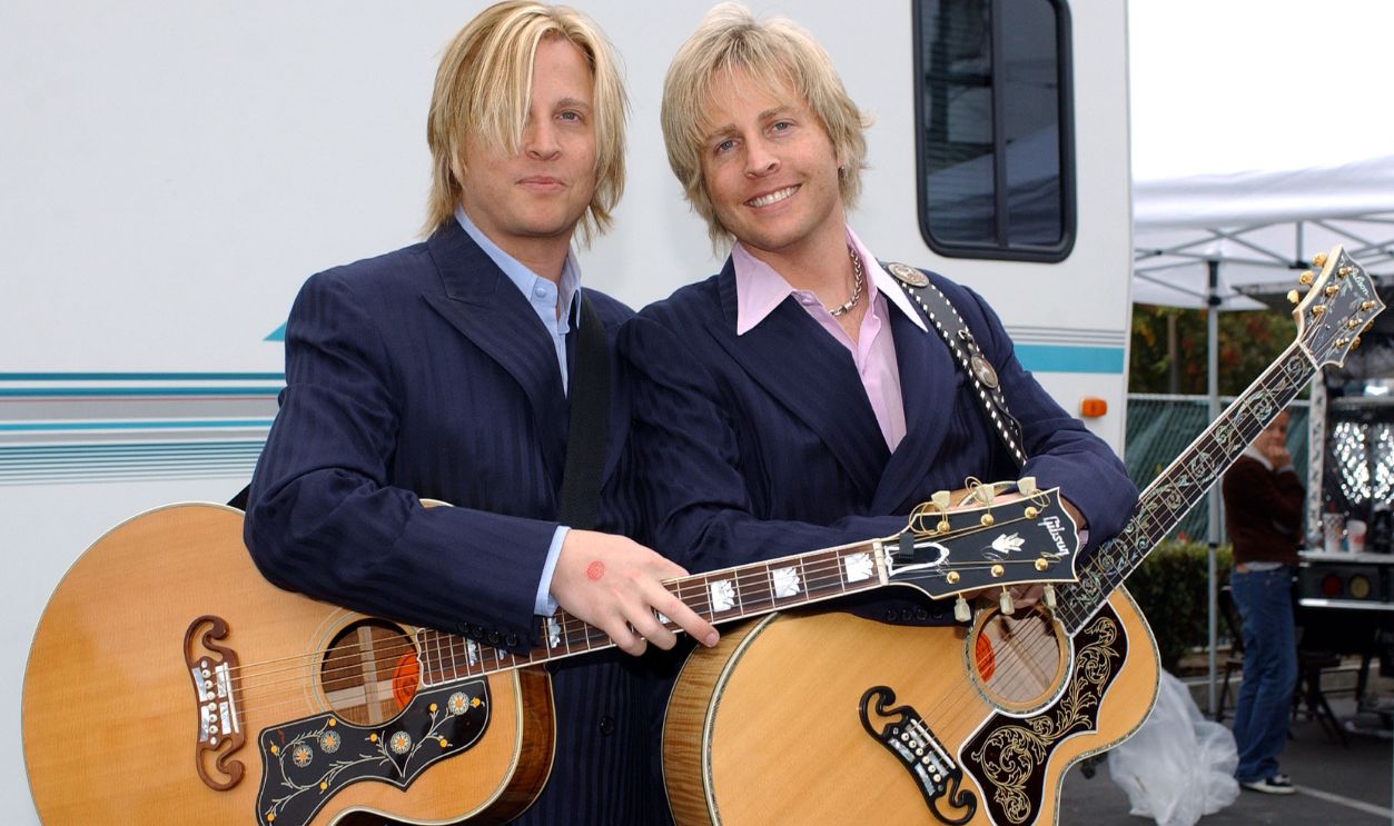 GLENDALE, CA - NOVEMBER 9: (L-R) Musicians Gunnar and Matthew Nelson stand backstage as they attend the Love Ride 20 at Harley-Davidson/Buell of Glendale November 9, 2003 in Glendale, California. The yearly motorcycle cruise and concert, hosted by Grand Marshal Jay Leno, benefits the Muscular Dystrophy Association, Reading by 9 and other charities.