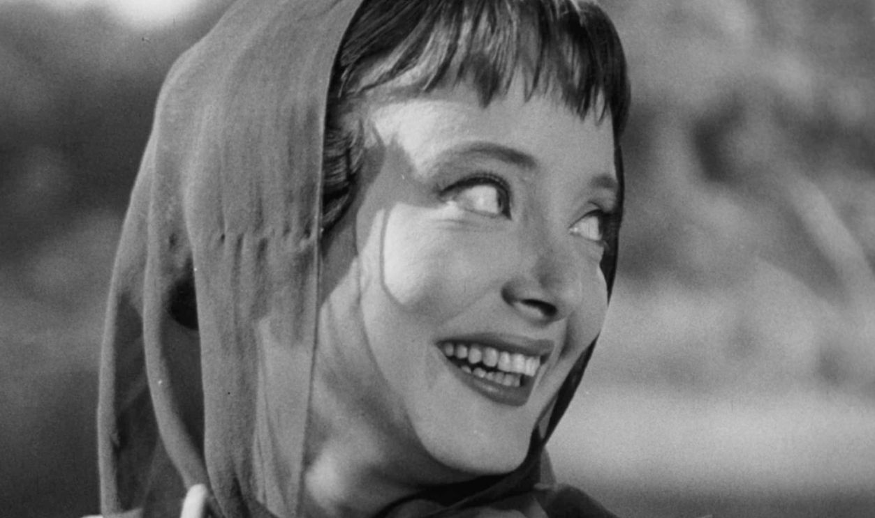 Carolyn Jones in convertible in a scene from the film 'The Man In The Net', 1959.