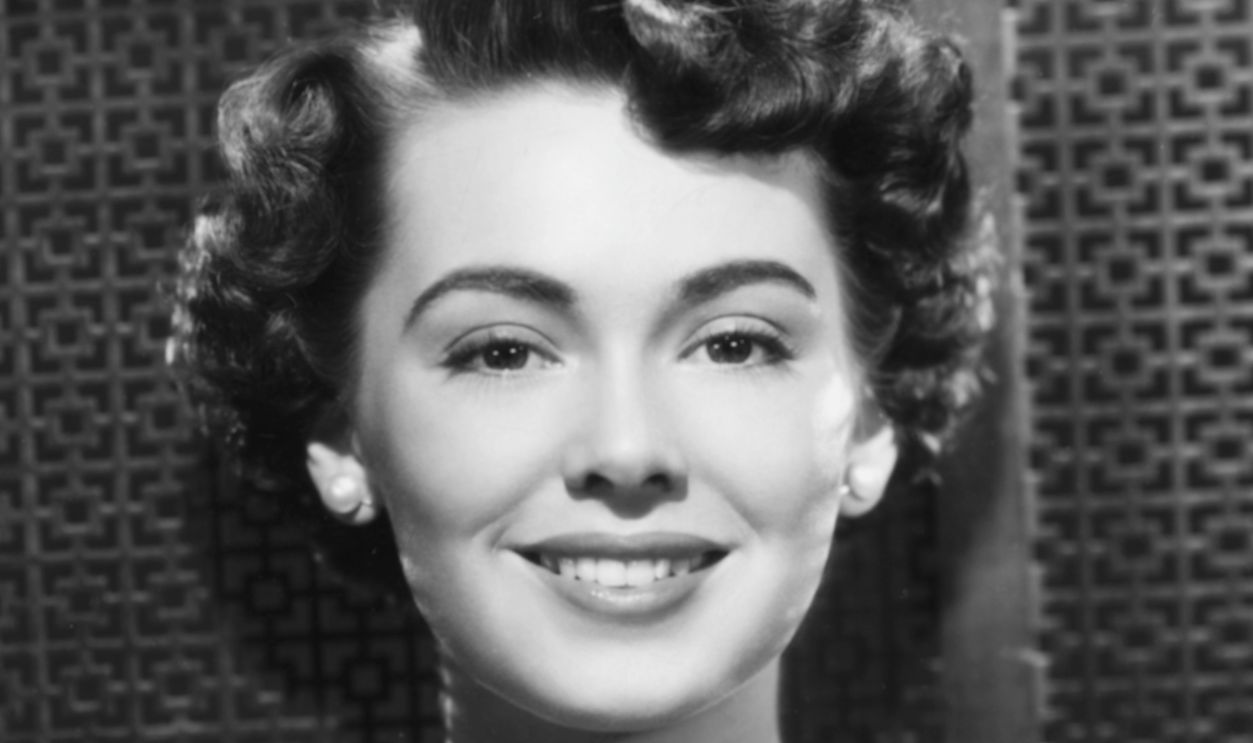 Portrait of actress Barbara Rush wearing a pearl necklace, circa 1950.