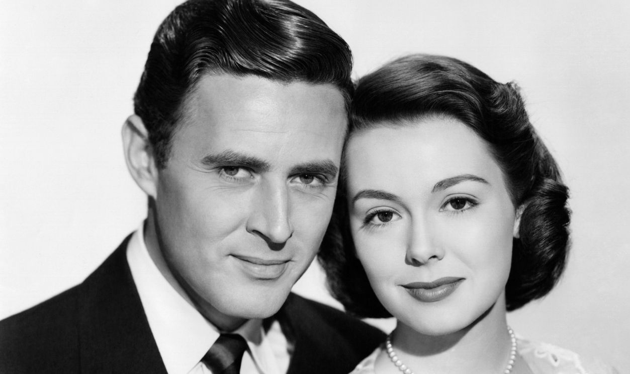 Publicity shot of actors Peter Hansen (1921-2017) as 'Ted Gordon' and Barbara Rush, as 'Debby Sherman' in the film 'The Goldbergs', 1950, United States. The movie was Rush’s cinematic debut.