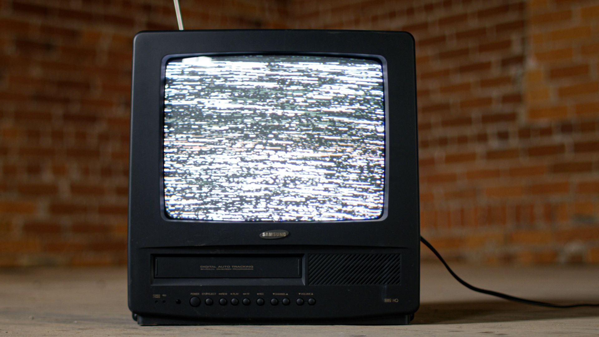 black crt tv on brown wooden table