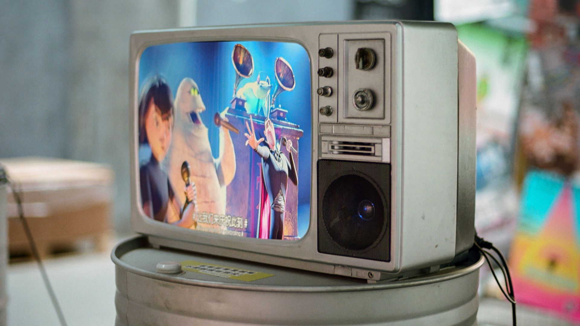 A small television sitting on top of a can