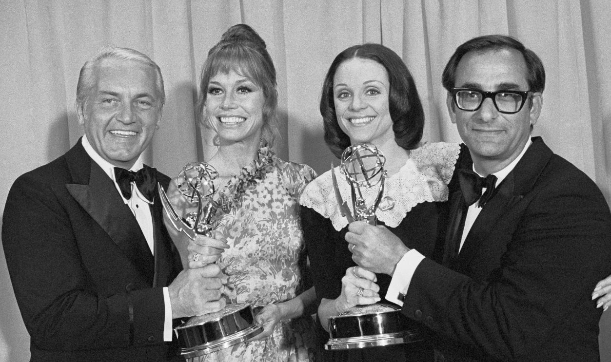 Emmy Award winners from The Mary Tyler Moore Show gather backstage after the awards. (Left to right) Ted Knight (Ted Baxter), Mary Tyler Moore (Mary Richards), Valerie Harper 