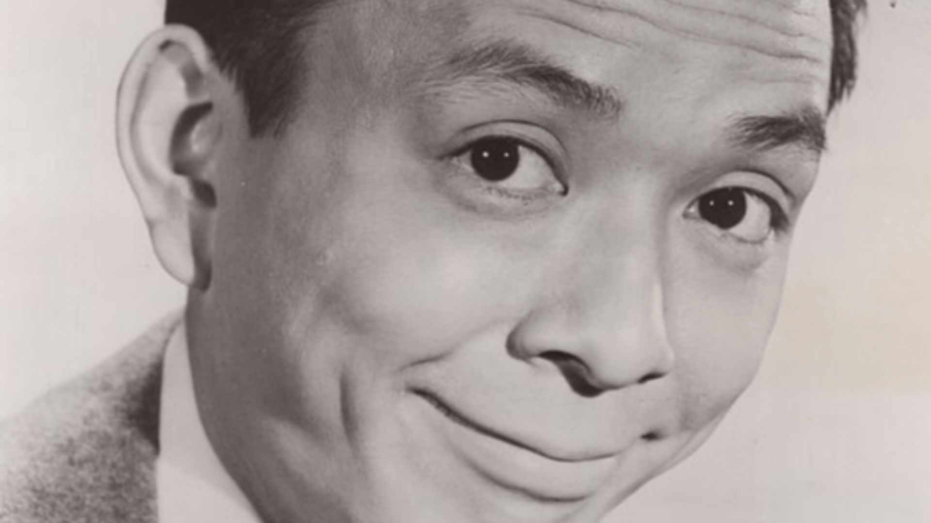 Actor James Hong as Barry Chan in a publicity picture of the syndicated series The New Adventures of Charlie Chan
Caption reads: James Hong is the lovable, laughable Number One Son of the one and only Charlie Chan in
