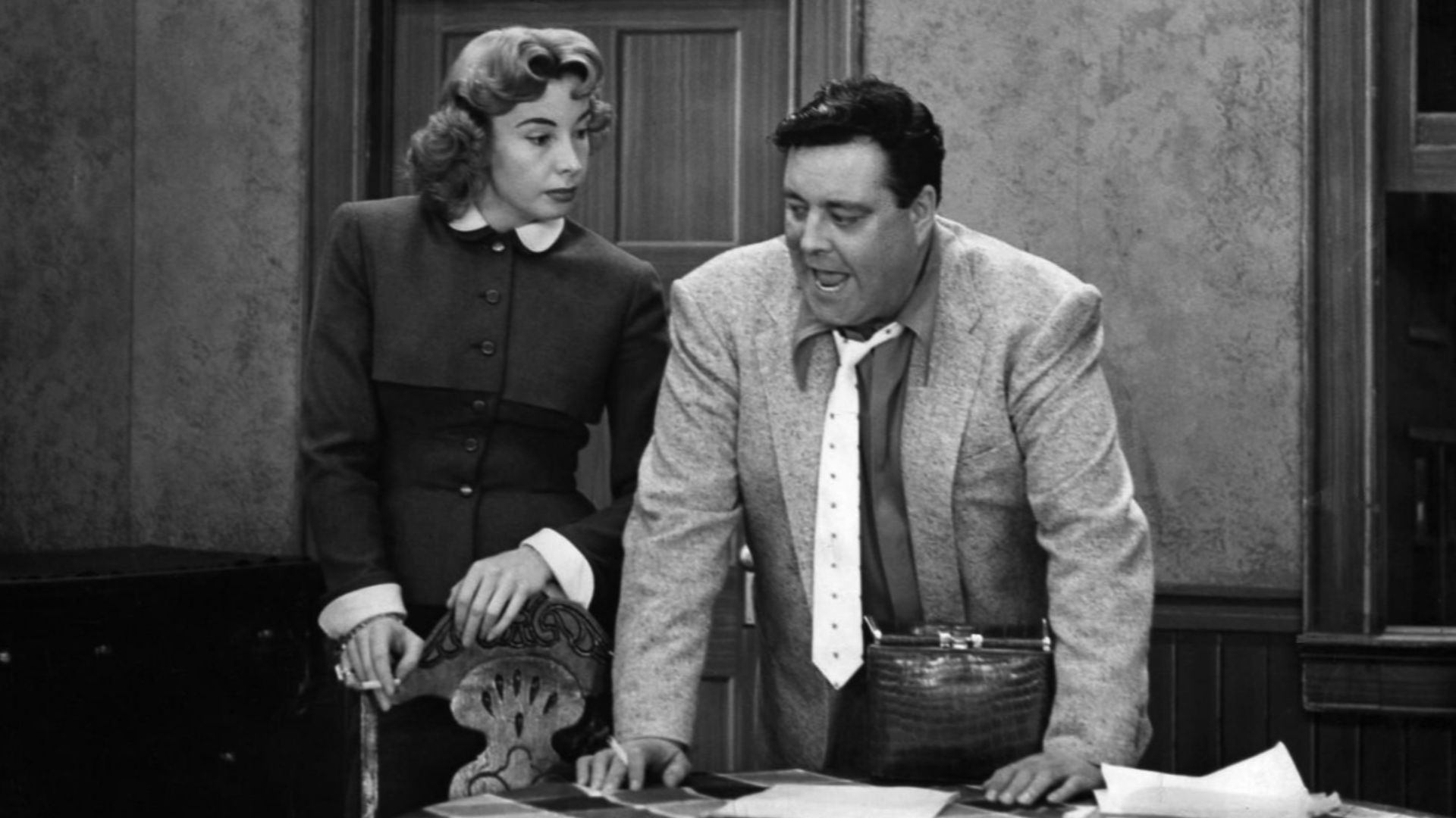 Photo of Audrey Meadows and Jackie Gleason as Ralph and Alice Kramden from the television program The Honeymooners.