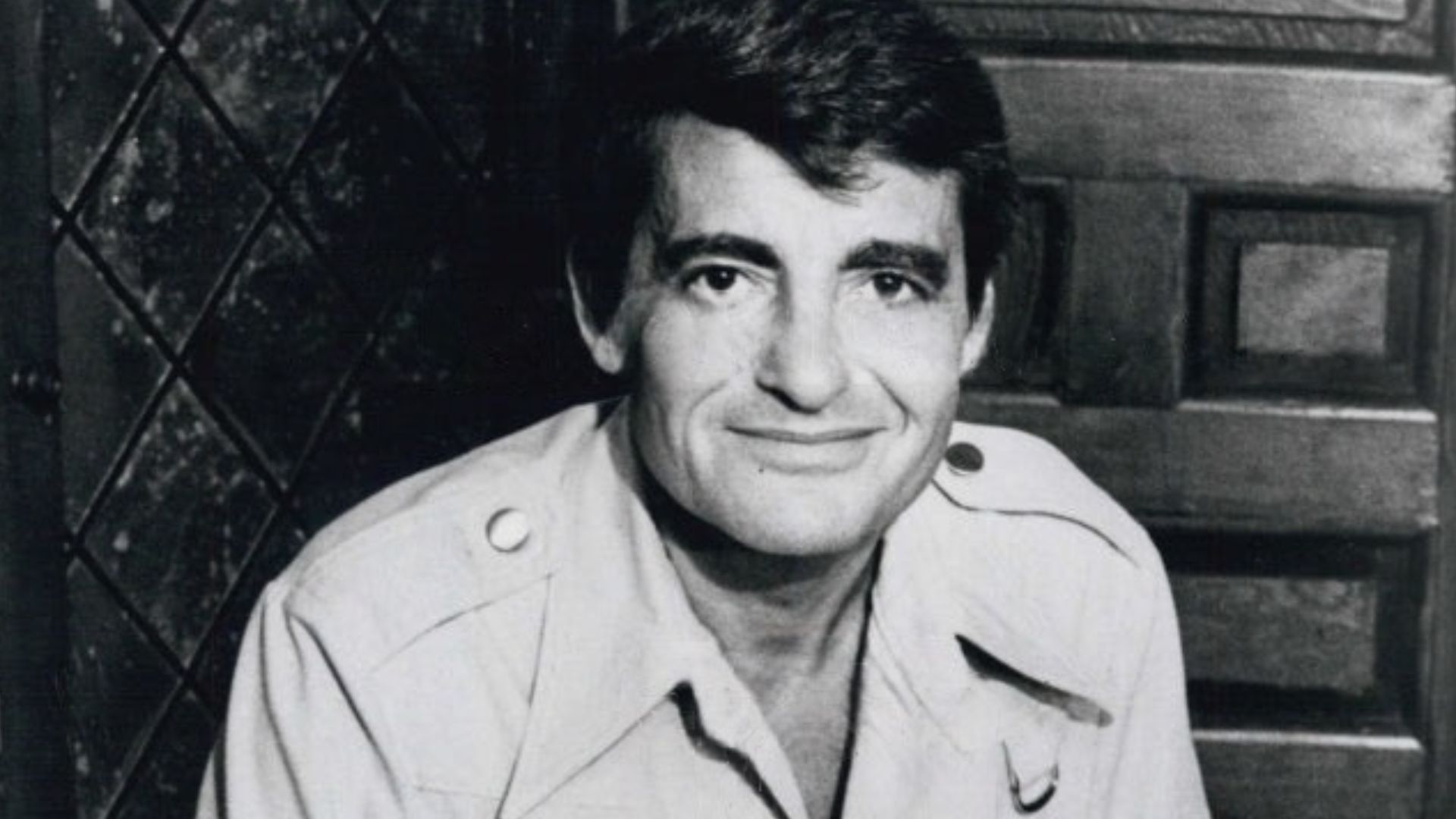 This is a publicity photo, circulated for publicity, of Tom Troupe, published in 1977 without copyright notice, qualifying it under public domain.