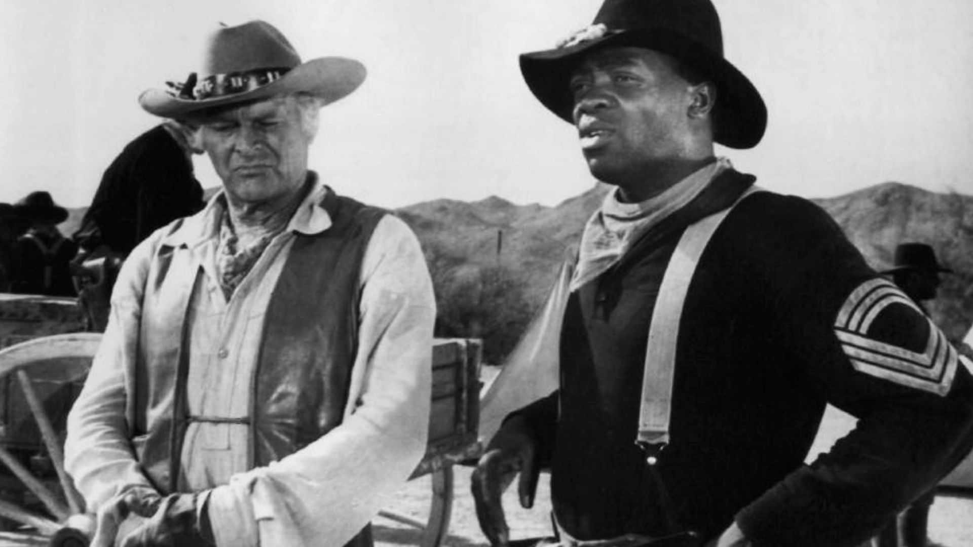 Photo of Leif Erickson as John Cannon and Yaphet Kotto as the leader of an all African-American group of cavalry soldiers from the television program The High Chaparral.