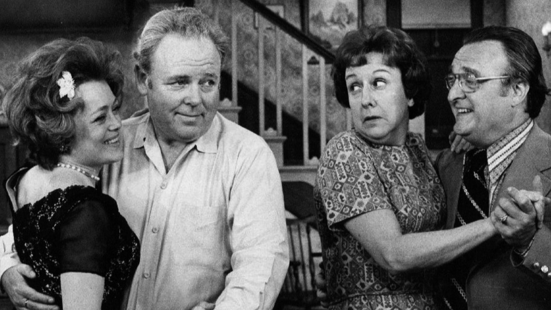 Photo of Rue McClanahan and Vincent Gardenia as Ruth and Curtis Rempley with Carroll O'Connor and Jean Stapleton as Archie and Edith Bunker.  When Edith invites a nice new couple she met to come to the Bunkers for the evening, after switching dancing part
