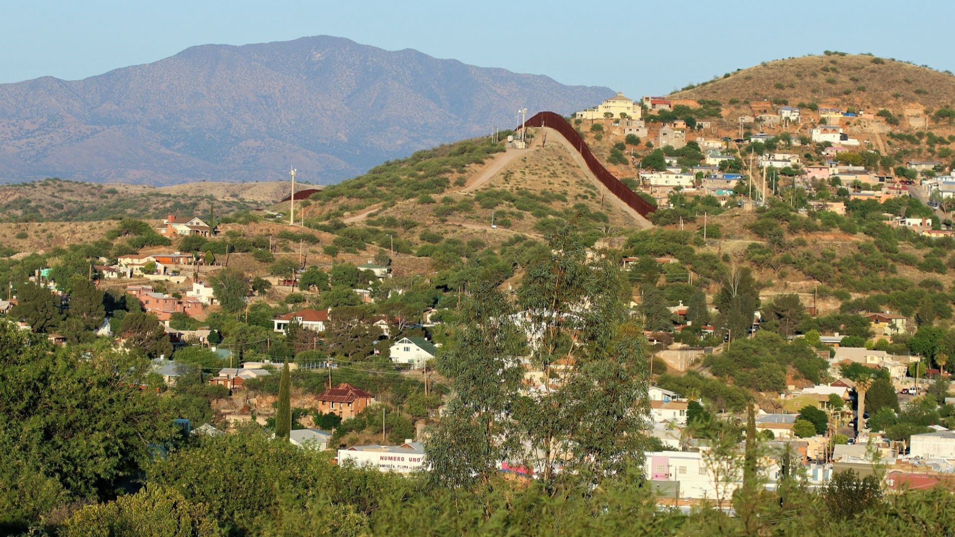 View of Nogales, Arizona/Sonora — from Arizona. 

The fence dividing Arizona and Mexico is visible in center of photo.