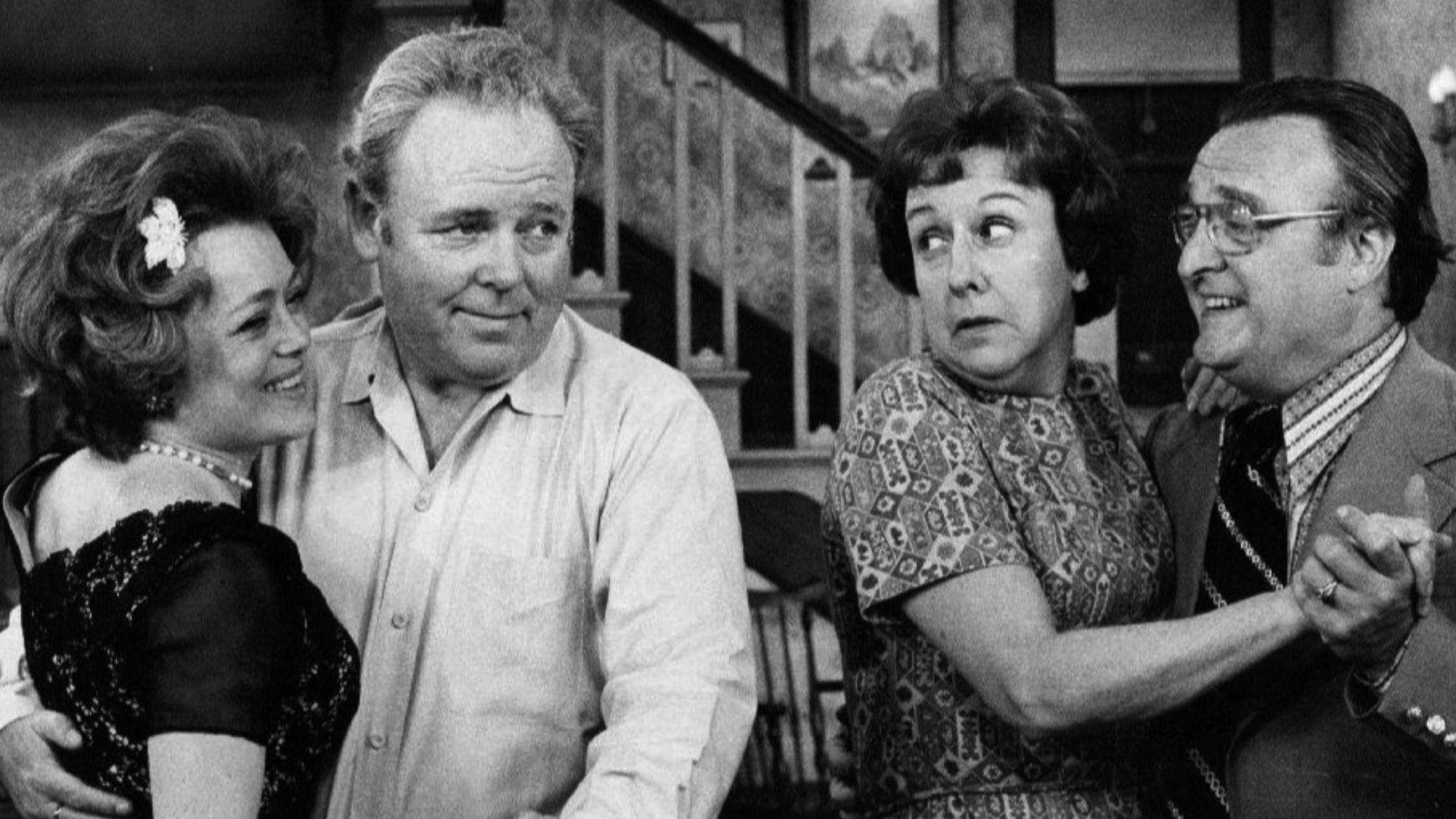 Photo of Rue McClanahan and Vincent Gardenia as Ruth and Curtis Rempley with Carroll O'Connor and Jean Stapleton as Archie and Edith Bunker.  When Edith invites a nice new couple she met to come to the Bunkers for the evening, after switching dancing part