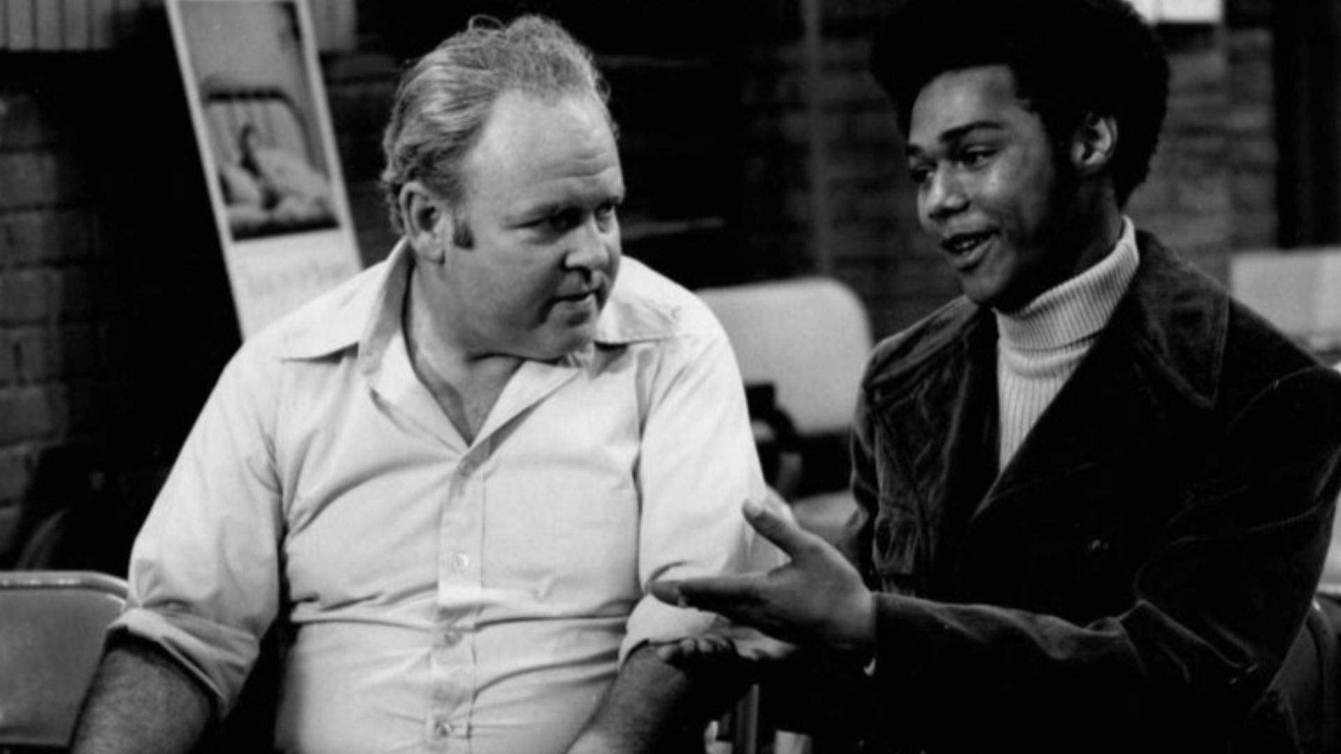 Publicity photo from the television program All in the Family.  Pictured are Carroll O'Connor (Archie Bunker) and Michael Evans (Lionel Jefferson).  In this episode, Archie visits a local blood bank to donate and meets his neighbor, Lionel Jefferson, who 