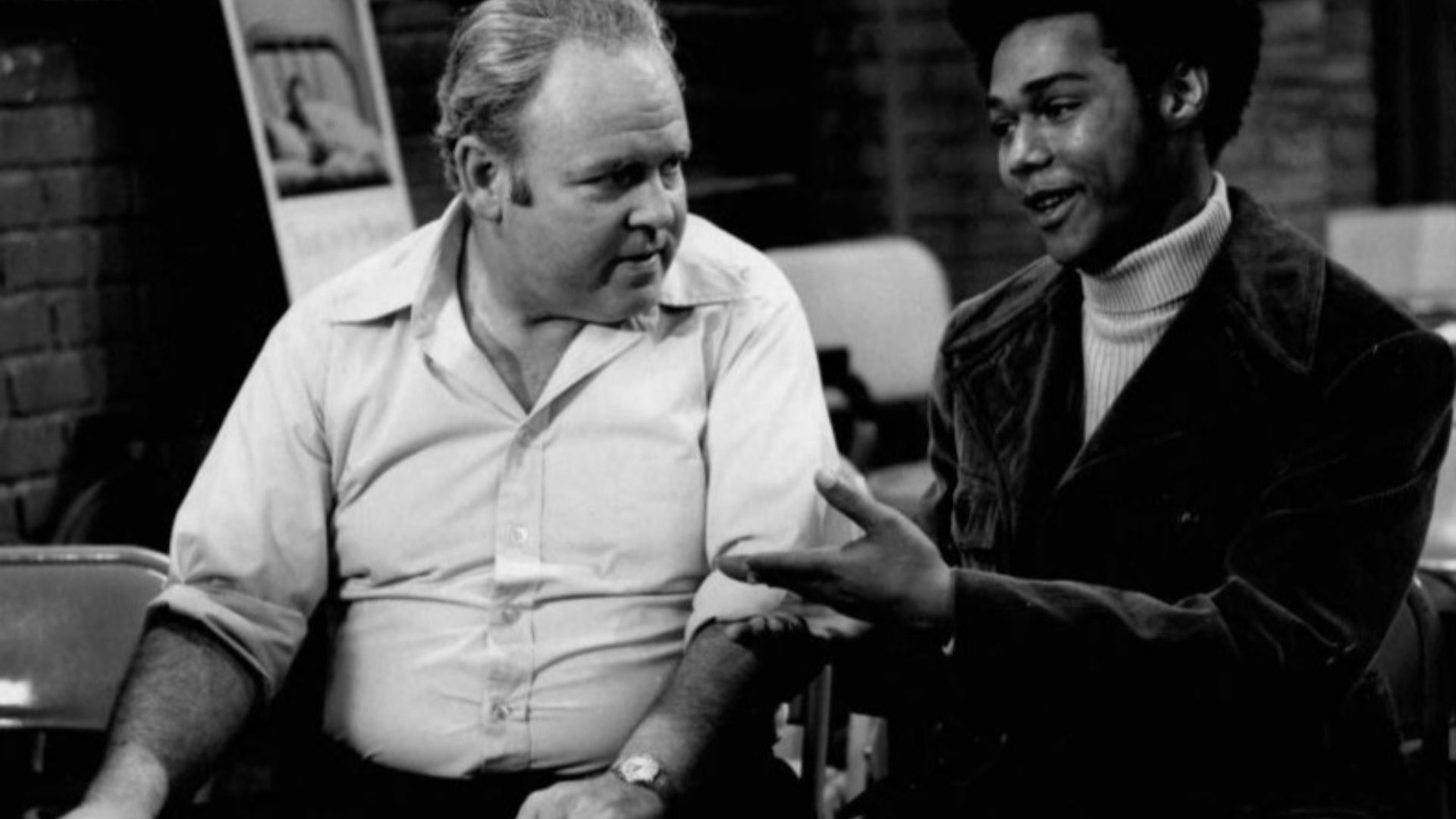 Publicity photo from the television program All in the Family.  Pictured are Carroll O'Connor (Archie Bunker) and Michael Evans (Lionel Jefferson).  In this episode, Archie visits a local blood bank to donate and meets his neighbor, Lionel Jefferson, who 