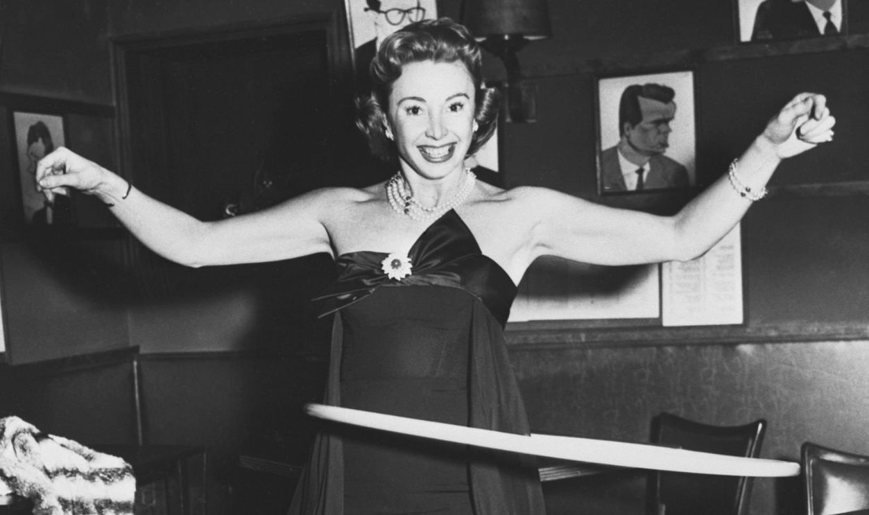 (Original Caption) New York: Hoop-De-Do. The contest was at least good for removing the extra inches off the waist. Audrey Meadows does a solo during the Hoop Contest which starred some of the city's top theatrical stars.