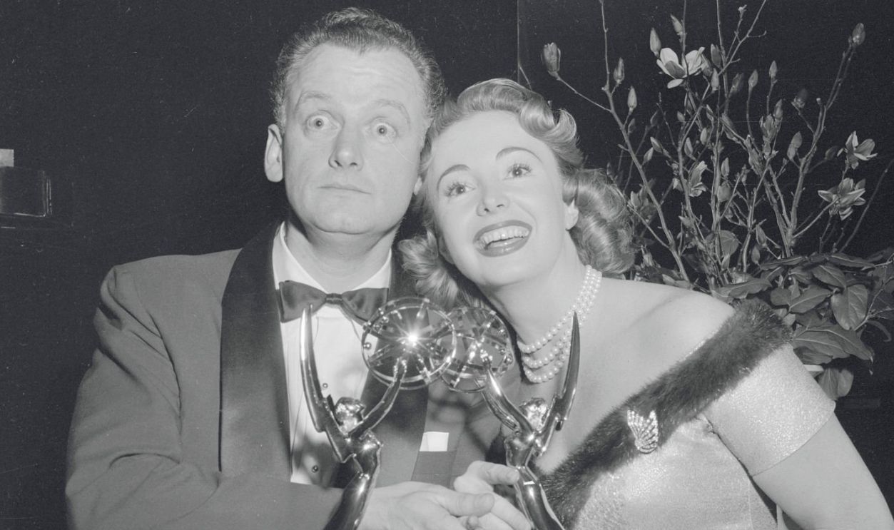 (Original Caption) New York: The Jackie Gleason Show got a double barreled bang out of tonight's annual Emmy award ceremony of the Academy of Television Arts and Science by copping both awards for best supporting actor and best supporting actress, which went to Art Carney and Audrey Meadows shown with their Emmys. The awards ceremony was conducted at New York and Hollywood and was televised nationally.