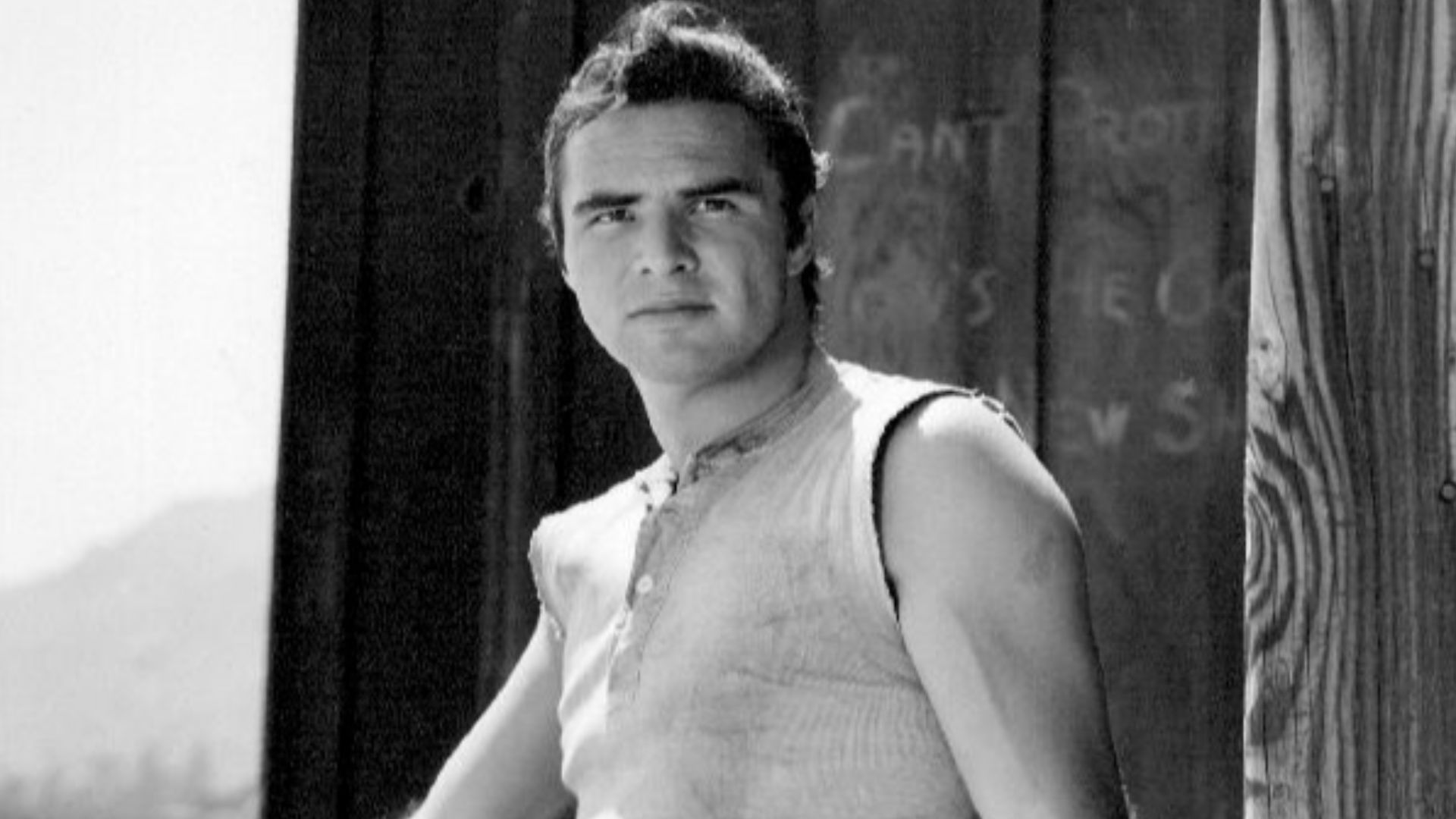 Publicity photo of Burt Reynolds as blacksmith Quint Asper from the television program Gunsmoke.
