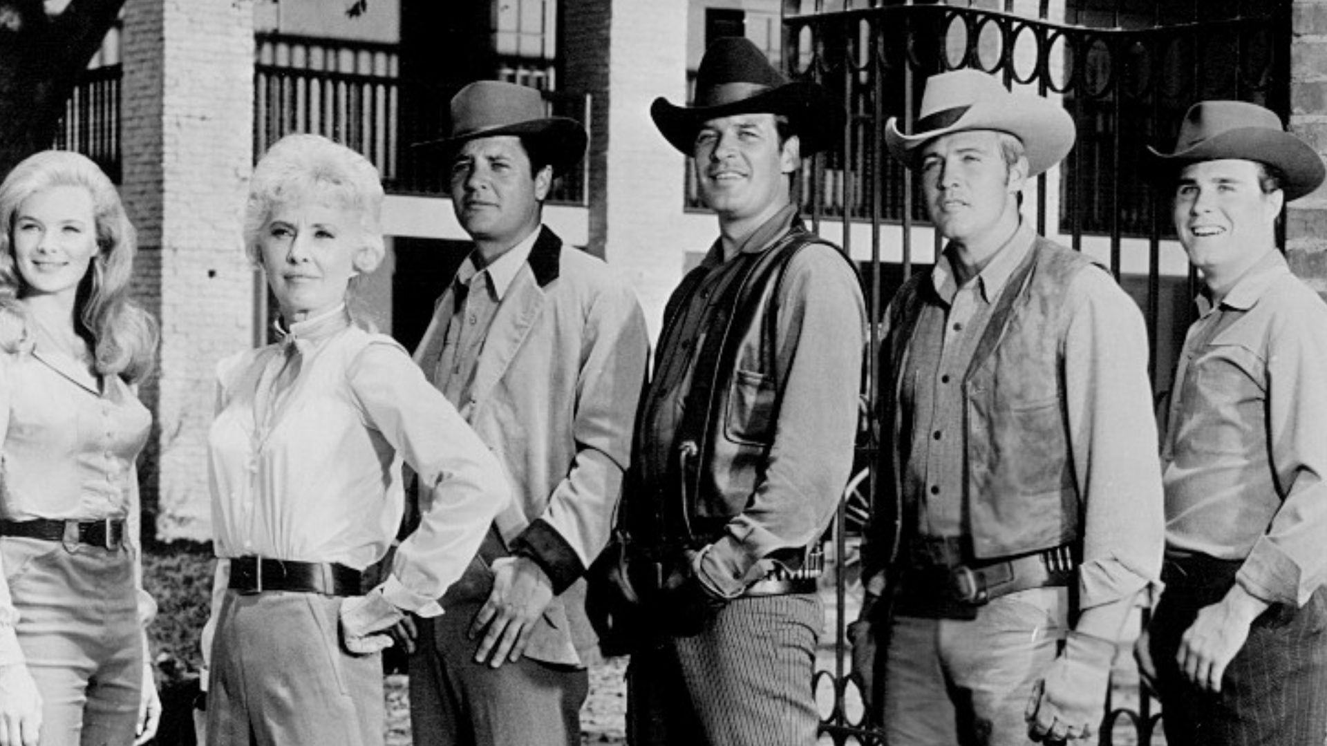 Photo of the cast of the television Western The Big Valley. From left: Linda Evans (Audra), Barbara Stanwyck (Victoria), Richard Long (Jarrod), Peter Breck (Nick), Lee Majors (Heath) and Charles Briles (Eugene).