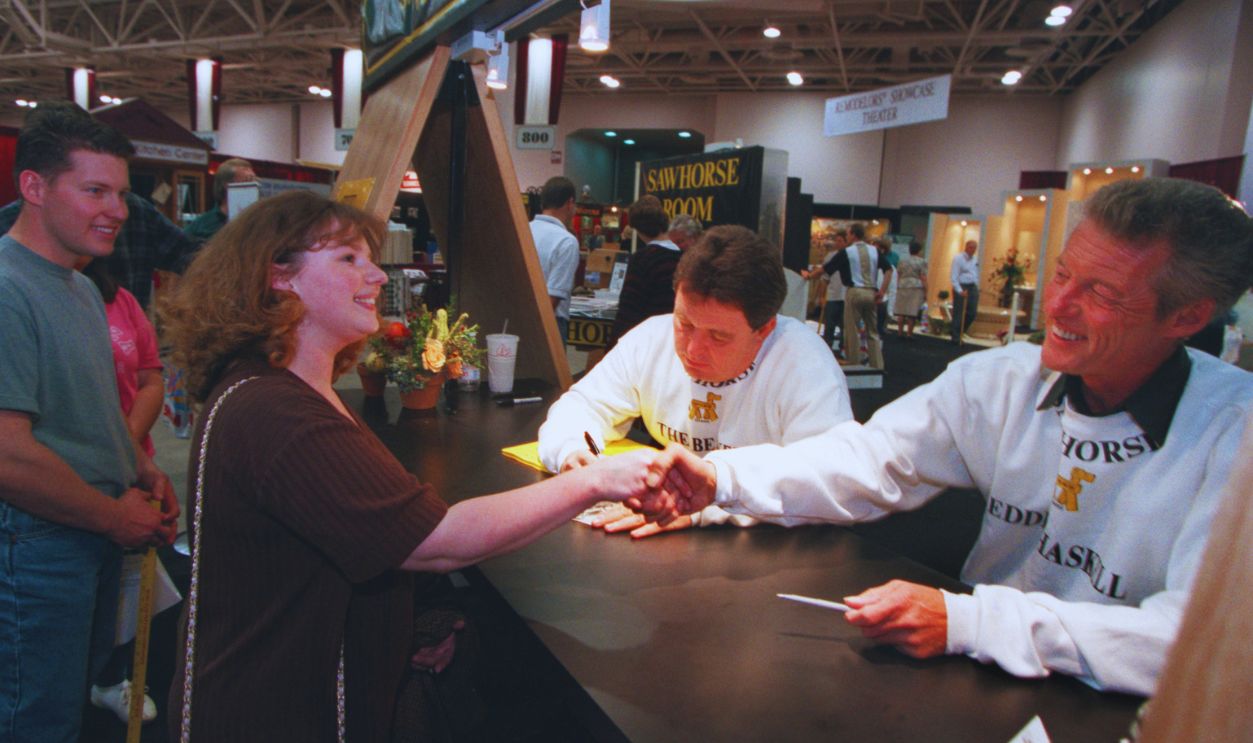 Gettyimages - 1154243532, Wendy Hesley of Big Lake shakes hands with Ken Osmond (Eddie Haskell) as Jerry Mathers (the Bever) signs an autograph during an session at the Minneapolis home and garden show
