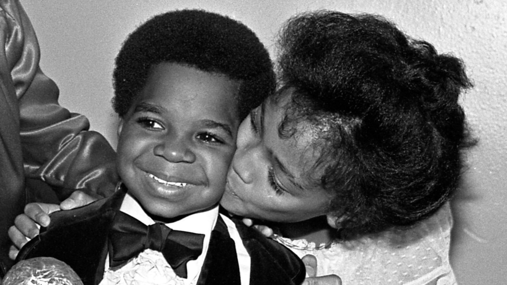 Gary Coleman clutches NAACP Image Award for the TV movie Kid From Left Field in which he starred. Looking on are Danielle Spencer, left, of What's Happening, and Kim Fields of The Facts of Life.