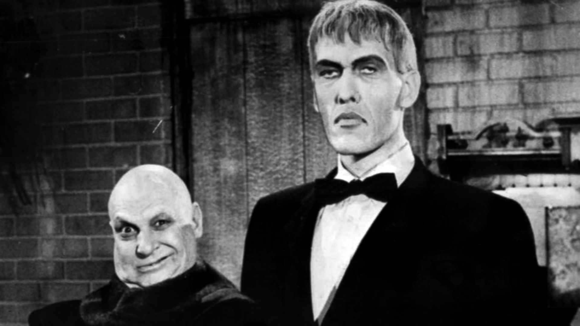 Publicity photo of Jackie Coogan (Uncle Fester) and Ted Cassidy (Lurch) from a personal appearance booking at Pleasure Island (Massachusetts amusement park, Wakefield Massachusetts).