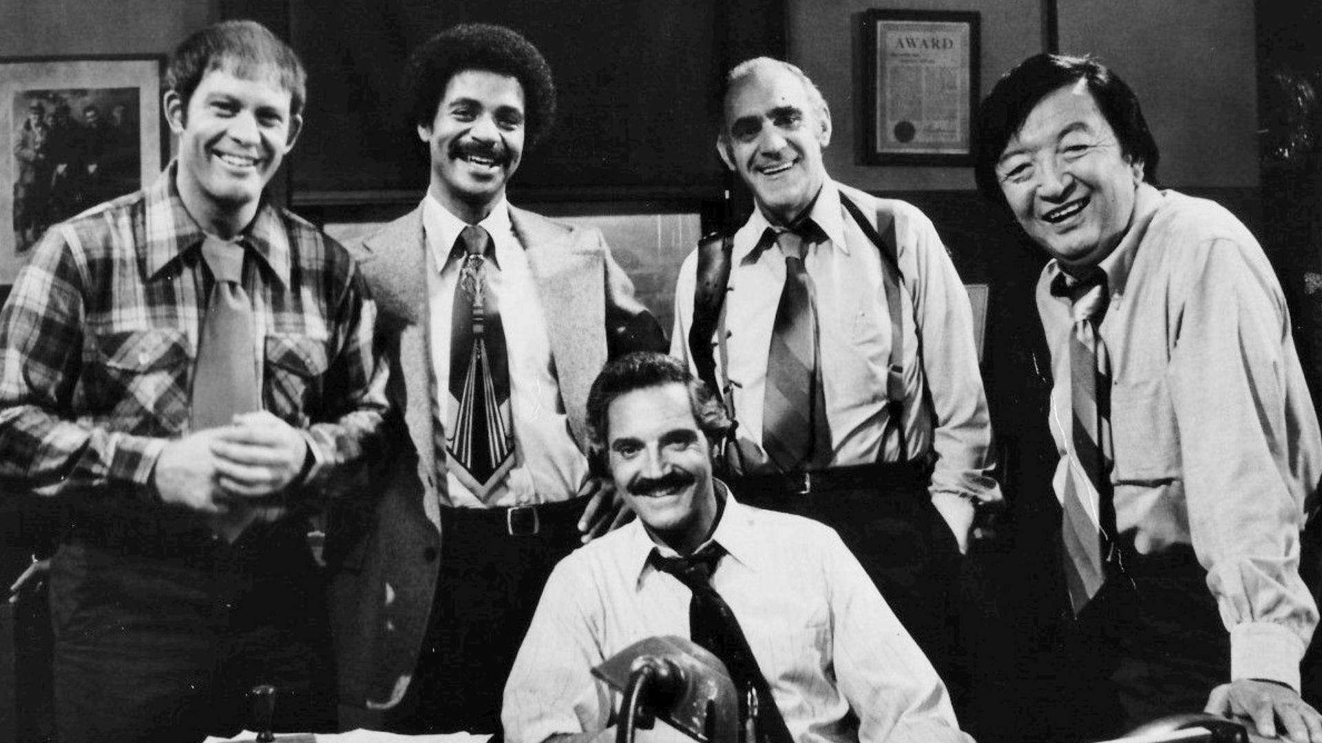 1977 cast photo from the television series Barney Miller.  From left: Max Gail (
