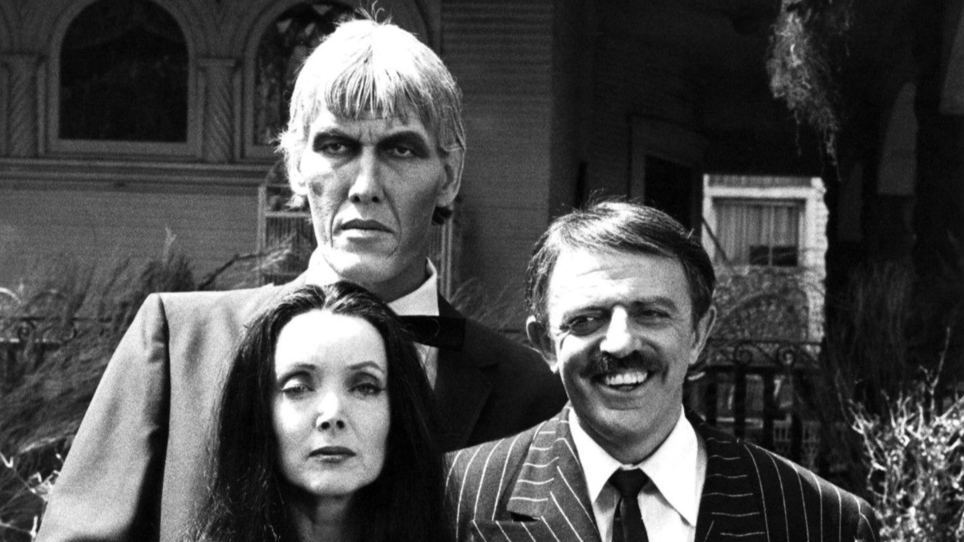 Photo of the main cast of the television program The Addams Family.  From left-Ted Cassidy (Lurch), Carolyn Jones (Morticia) and John Astin (Gomez).  In 1977, NBC reunited the original cast of the series for a Halloween Big Event Special.  This photo is f