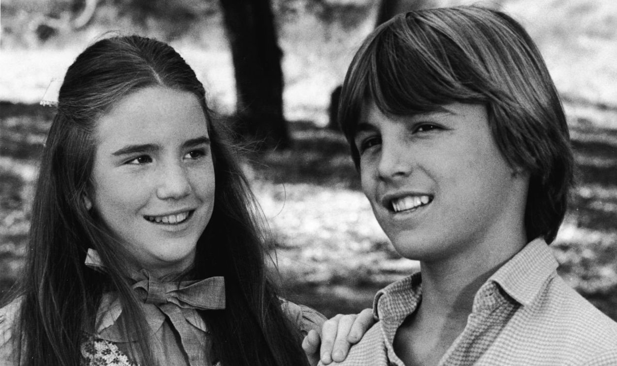 American actress Melissa Gilbert (as Laura Ingalls) places her hand on the shoulder of American actor Chris Petersen in a scene from the episode of the television series 'Little House on the Prairie' titled 'The Rivals,' 1977. The episode originally aired on January 9, 1978.