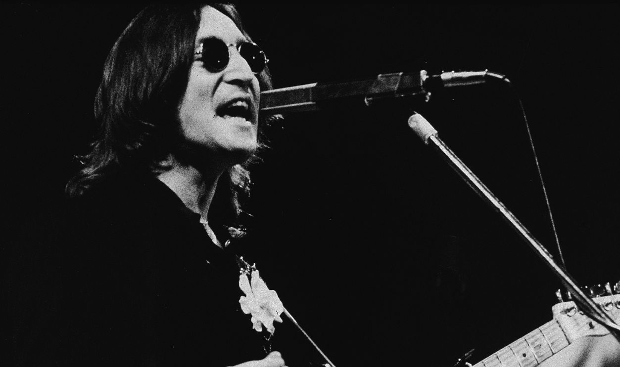 British musician John Lennon (1940 - 1980) performs onstage in Madison Square Garden, New York, New York, November 28, 1974. 