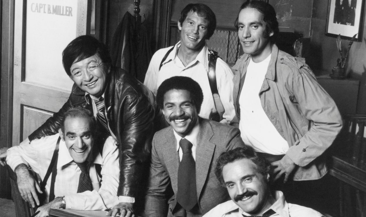 Getty Images - 517478892 - Cast of Barney Miller Posing Together on Set.