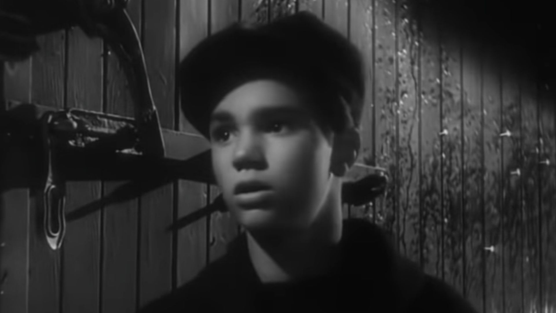 A screenshot of Darryl Hickman in the public domain film The Strange Love of Martha Ivers.