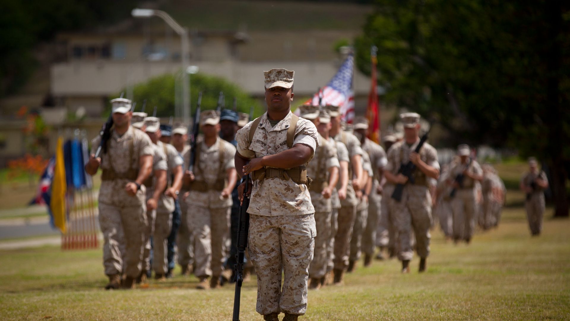 U.S. Marines assigned to Headquarters Battalion (HQBN), Marine Corps Base Hawaii (MCBH) march on during the HQBN, MCBH change of command ceremony at Dewey square aboard MCBH, Kaneohe Bay June 22, 2015. During the ceremony, U.S. Marine Corps Lt. Col. Rober