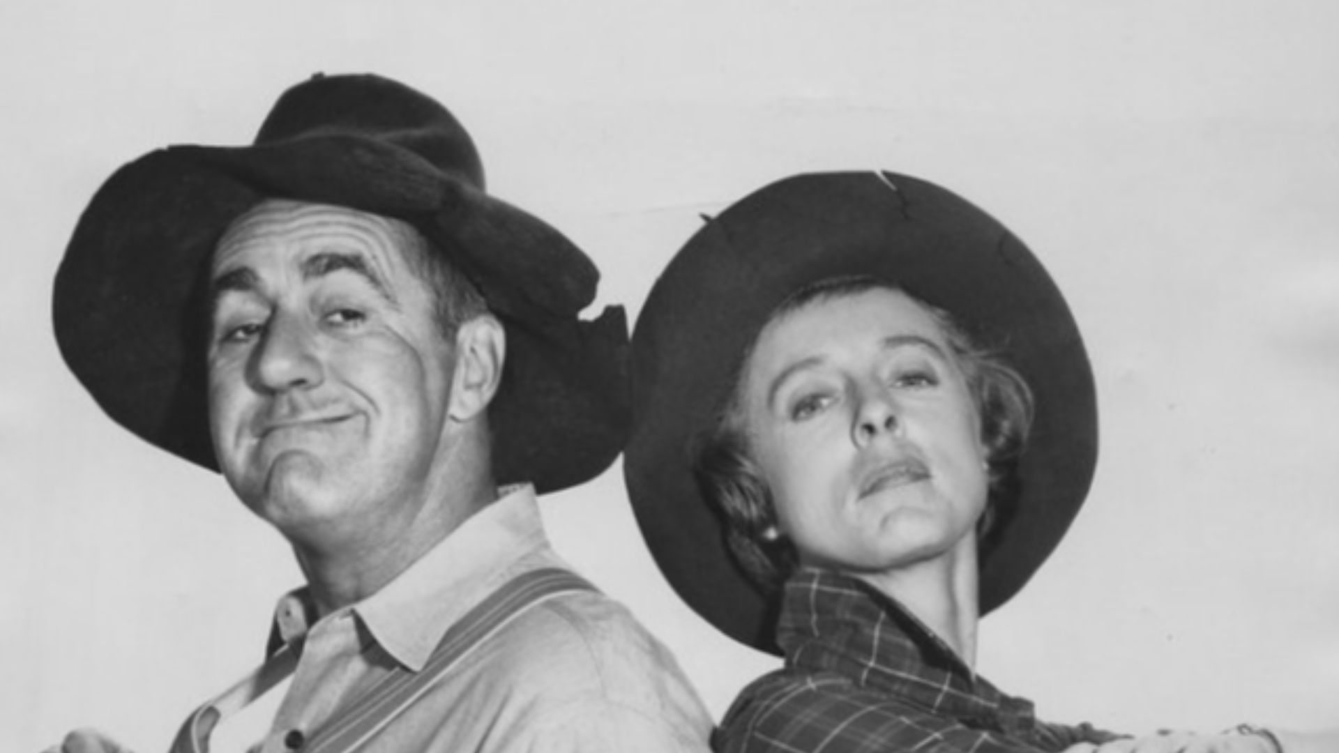 Publicity photo of guest star Jim Backus and Nancy Kulp from the television program The Beverly Hillbillies.  In this episode, Backus plays the Chairman of the board of Mr. Drysdale's bank.