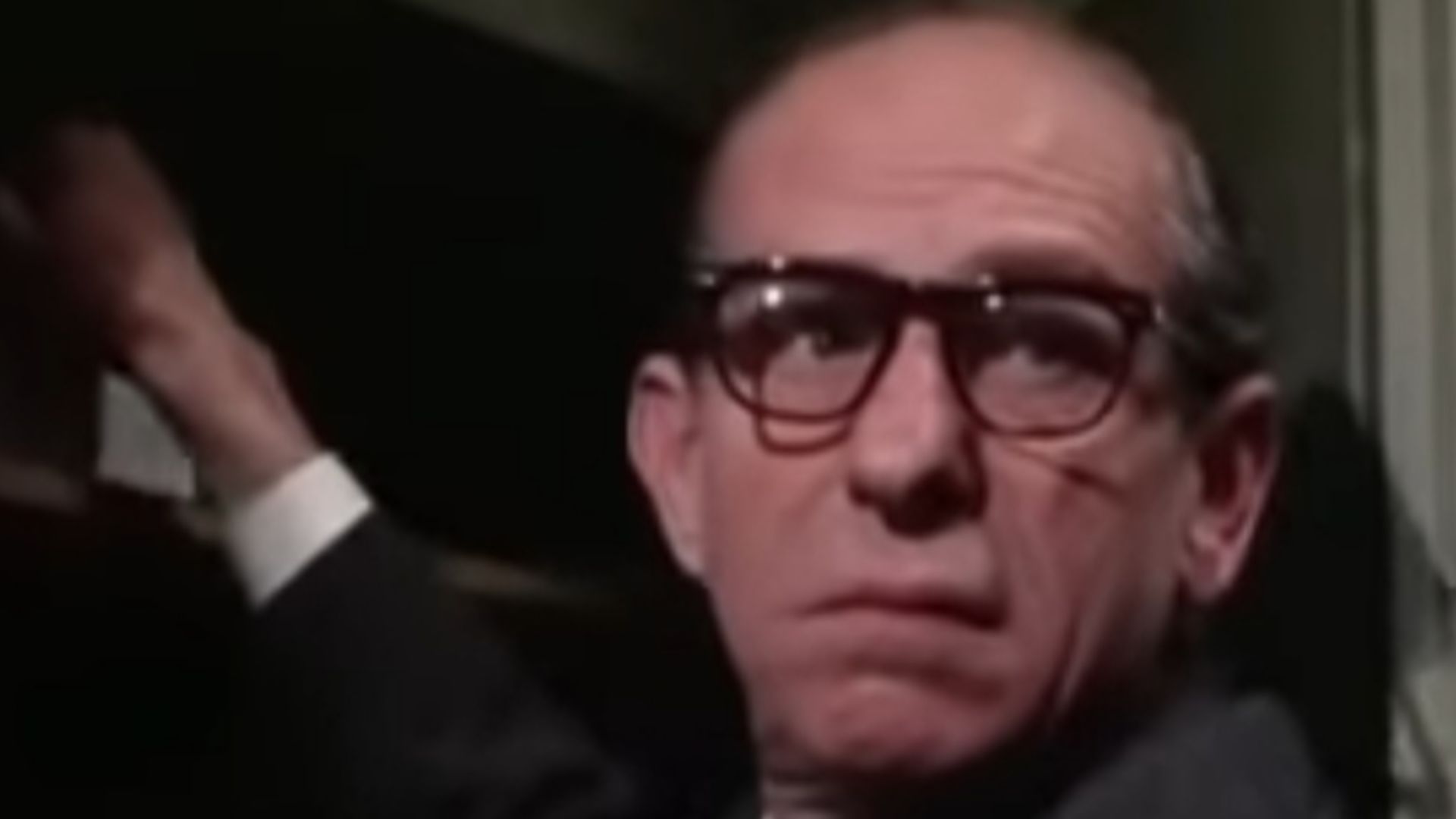Screenshot of Ned Glass from the film Charade