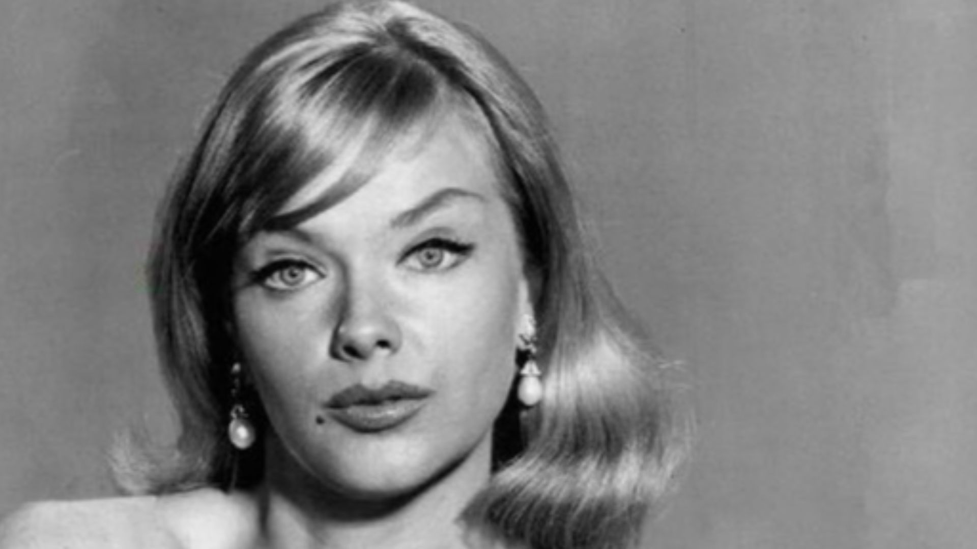 Photo of Anne Francis as Honey West and Bruce from the television program Honey West.