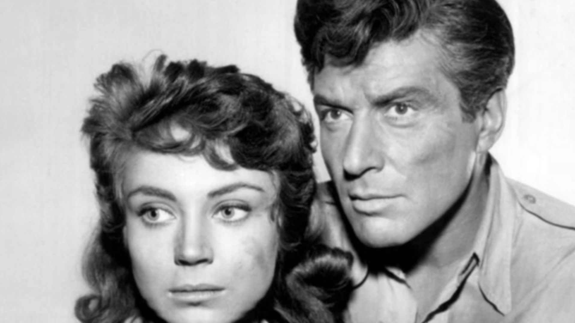 Photo of Efrem Zimbalist, Jr. as Stu Bailey and guest star Andra Martin.  Martin plays a noblewoman from a small country Bailey is hired to bring back to her homeland.  Political factions there opposing this try to prevent it by abandoning them both in th