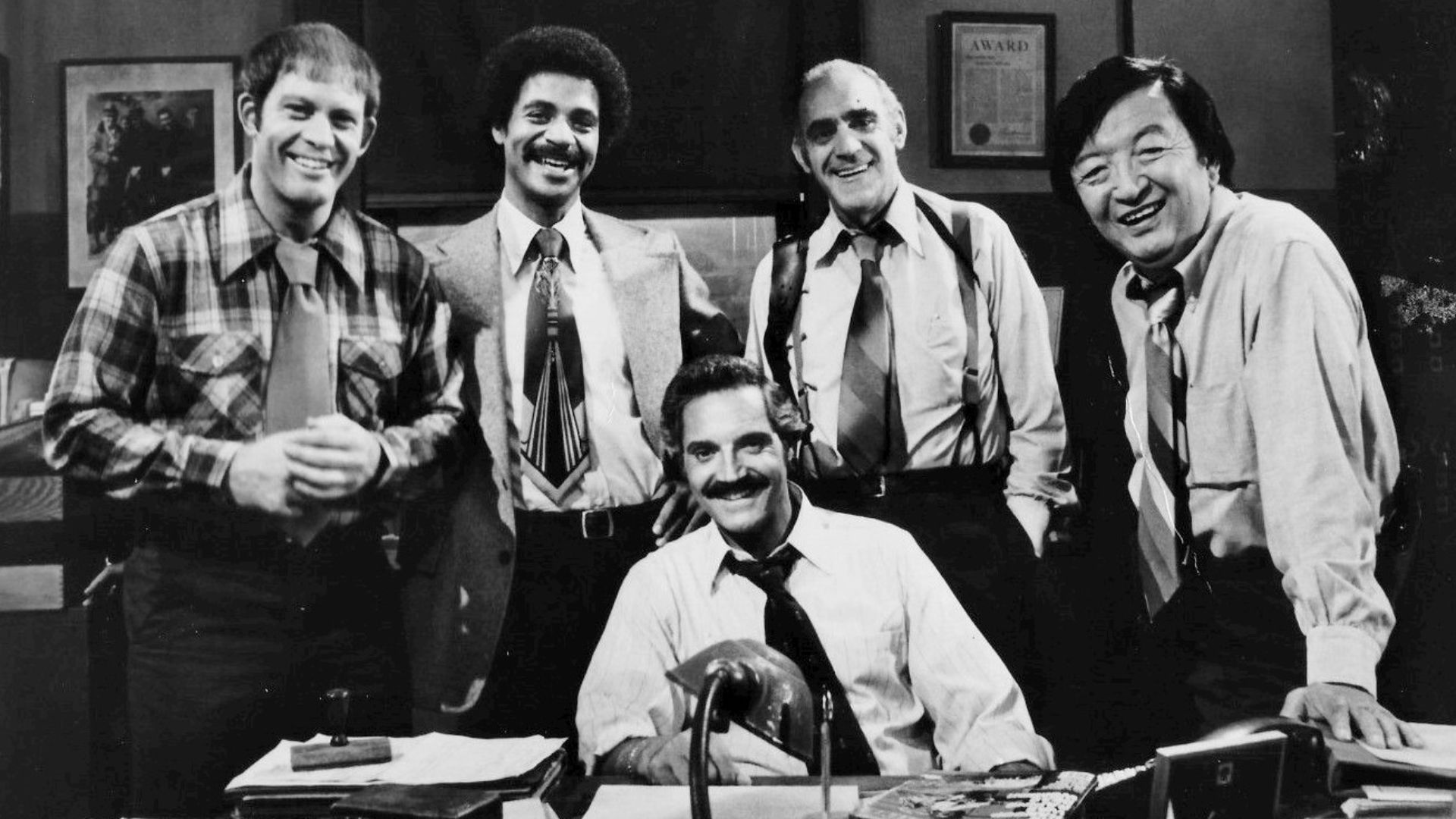 1977 cast photo from the television series Barney Miller.  From left: Max Gail (