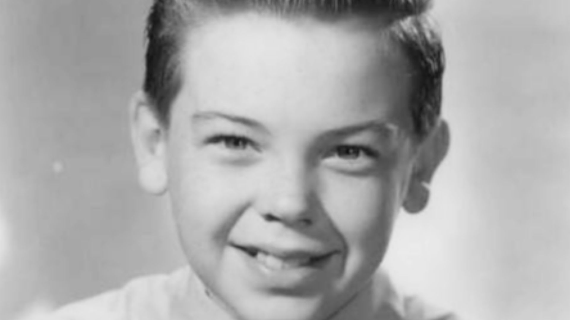 Publicity photo of American child actor, Bobby Driscoll promoting his appearance on the NBC television special One Hour in Wonderland, which aired on December 25, 1950.