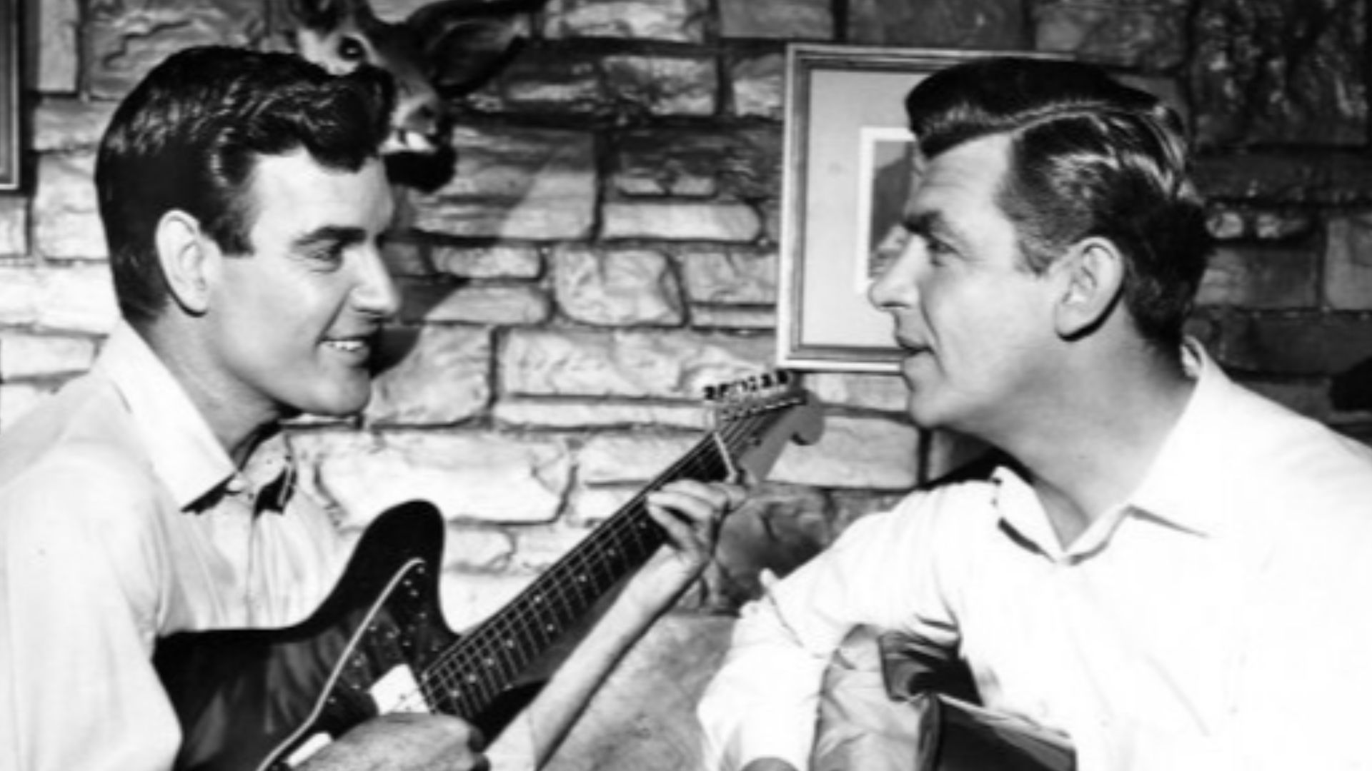 Photo of James Best and Andy Griffith from the television program The Andy Griffith Show. Best plays a former Mayberry resident, Jim Lindsey, who became a famous musician.