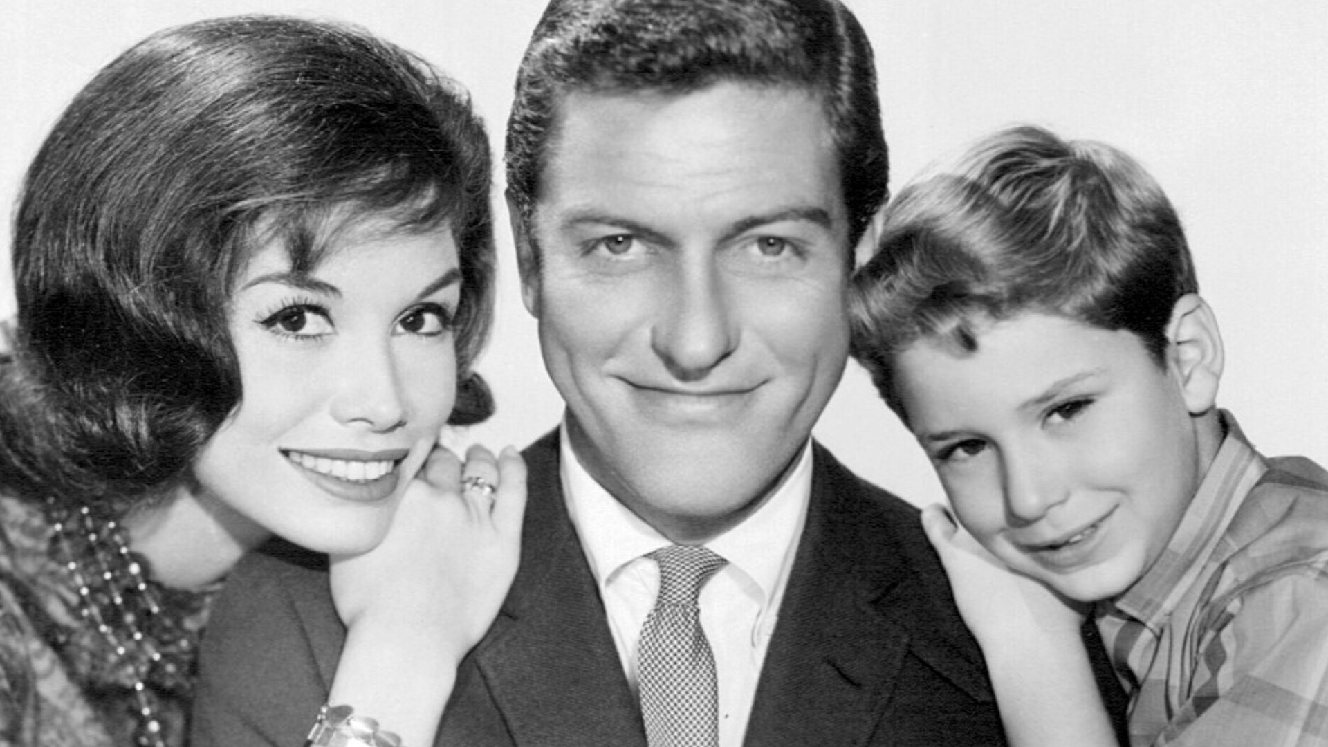 Photo of the Petrie family from the television program The Dick Van Dyke Show. From left-Mary Tyler Moore (Laura Petrie), Dick Van Dyke (Rob Petrie), Larry Mathews (Richie Petrie).
