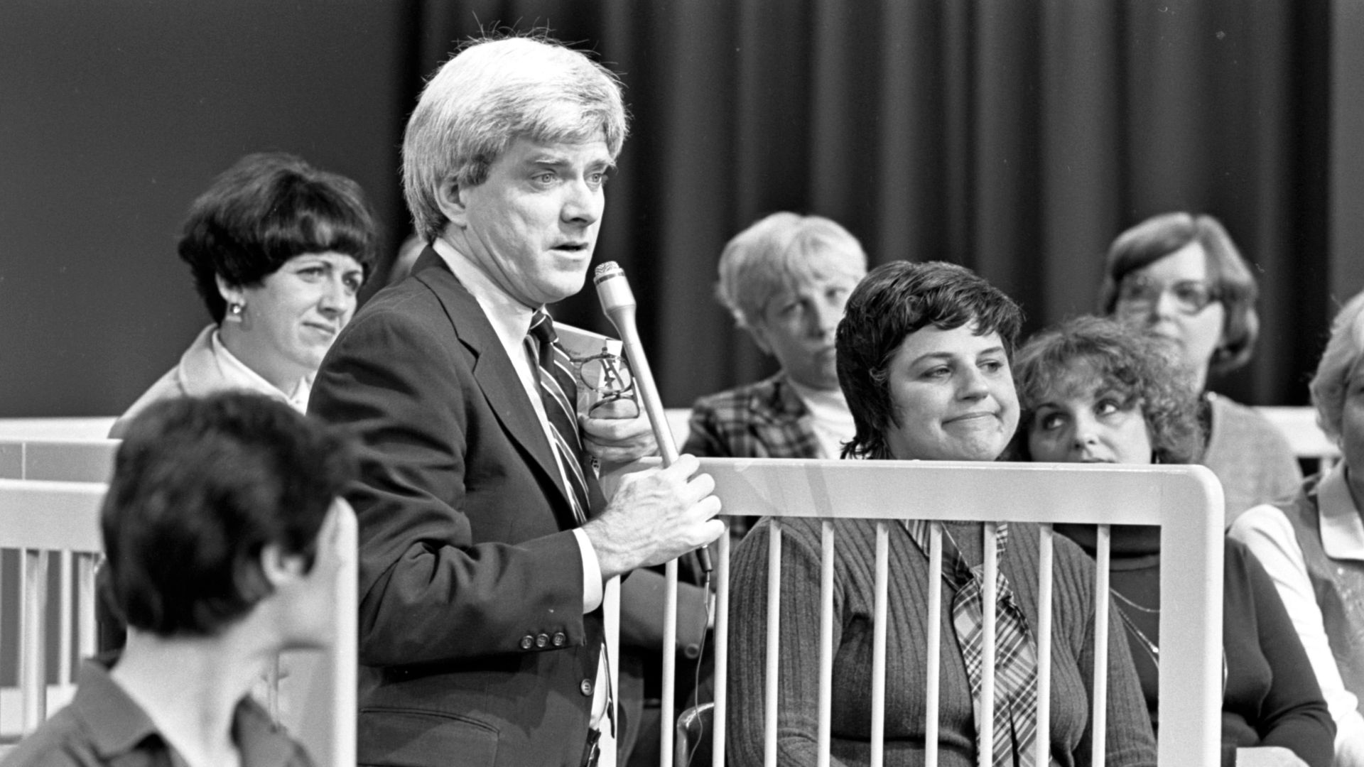 Daytime talk show host Phil Donahue with audience members in Chicago