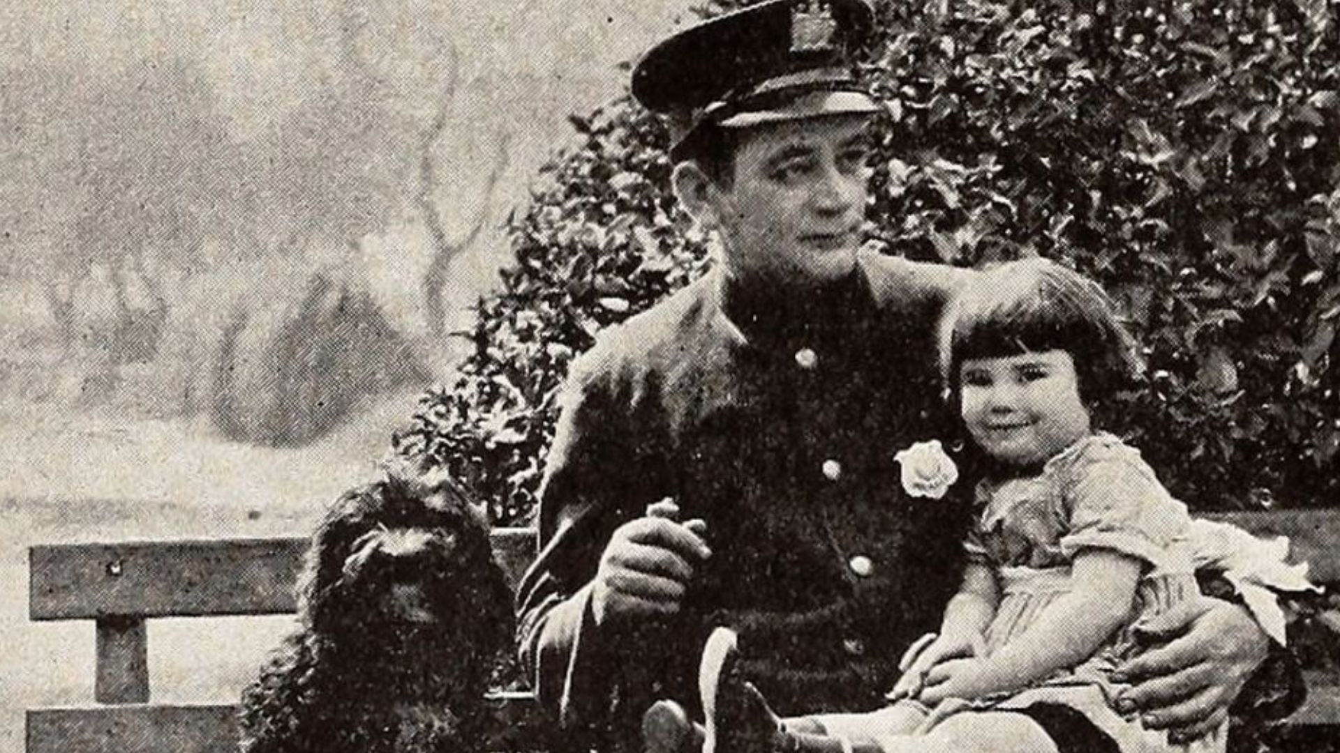 Still from the American comedy short film Taking Orders (1923) with an unidentified actor and Diana Serra Cary aka Baby Peggy, on page 404 of the January 20, 1923 Exhibitor's Trade Review.